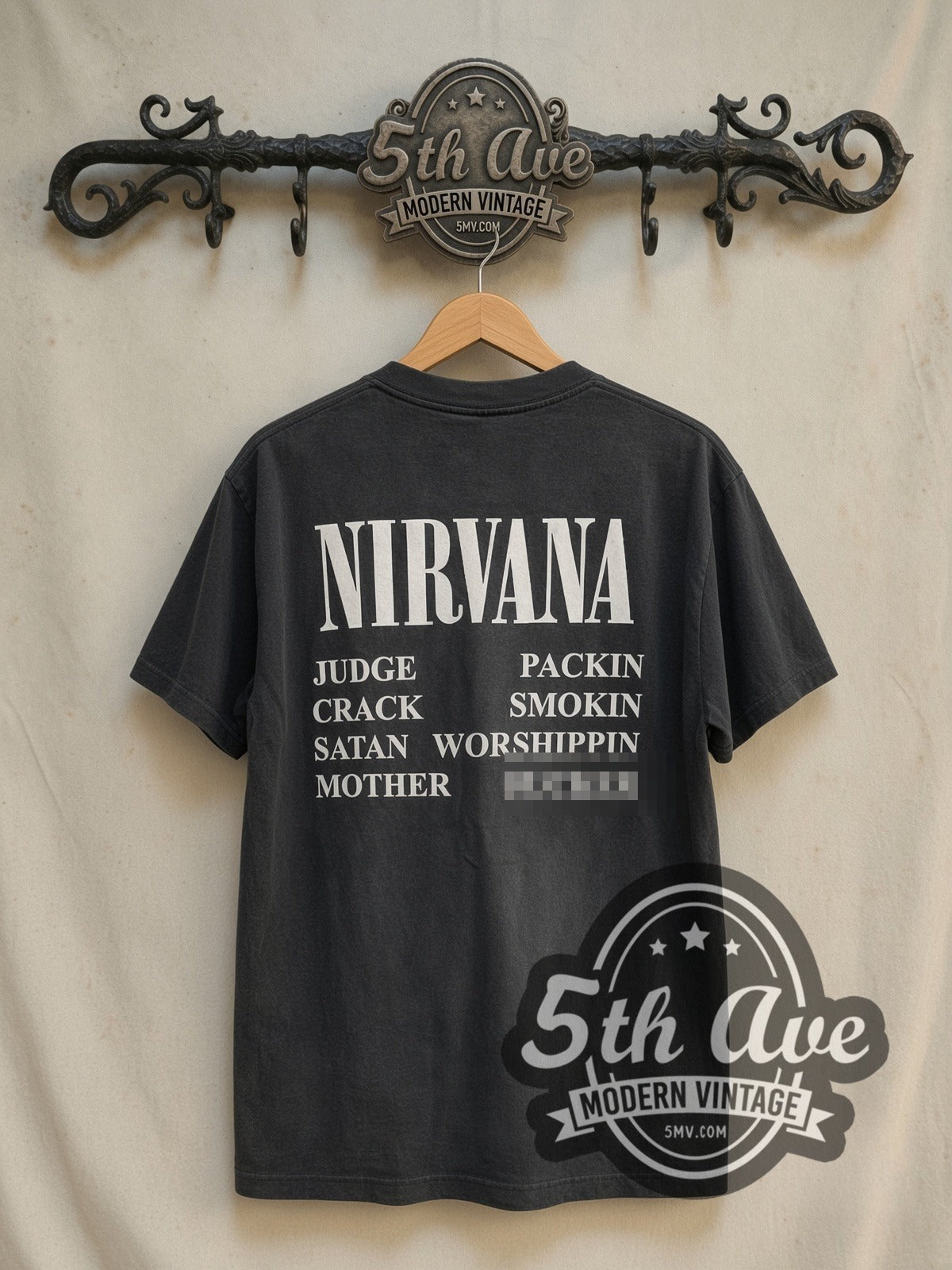 Nirvana Incesticide vintage band t-shirt in black, back view on a display rack
