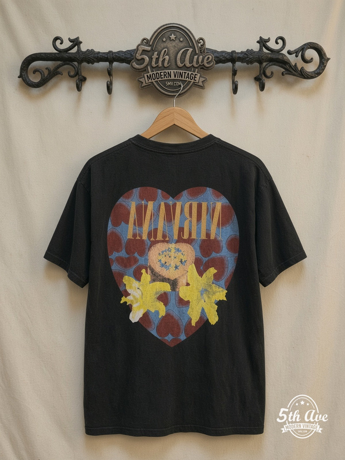 Nirvana “Heart Shaped Box” Tee – Front & Back Print — back on locked cream ornate 5th Ave rack