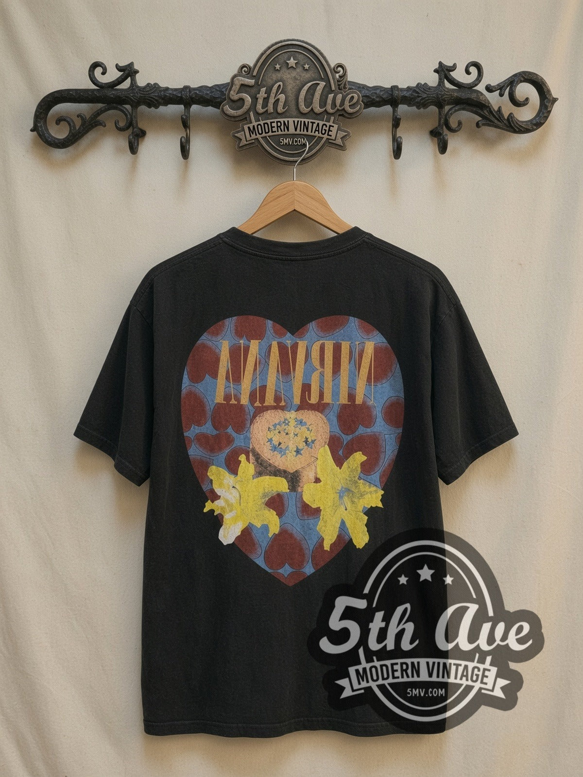 Nirvana Heart Shaped Box vintage band t-shirt, back view on a display rack