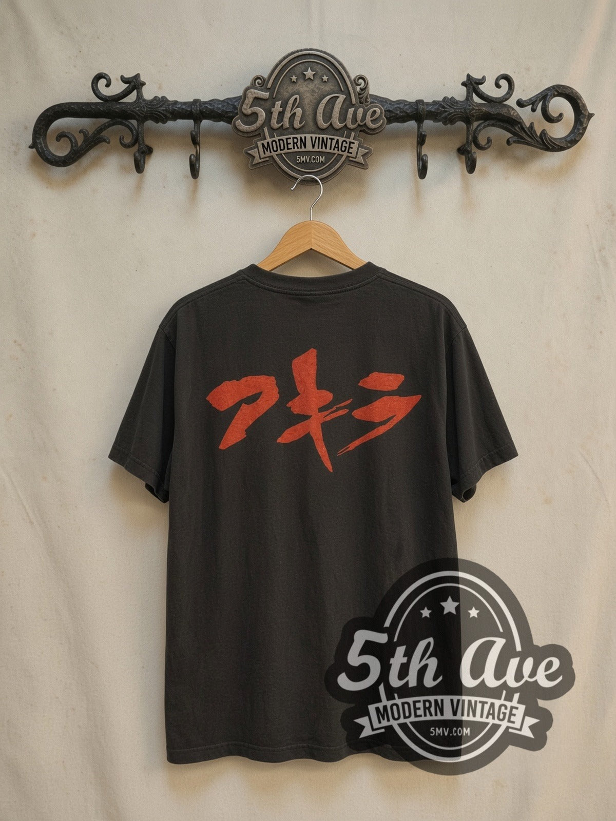 Akira Neo-Tokyo Is About to Explode vintage graphic t-shirt, back view on a display rack