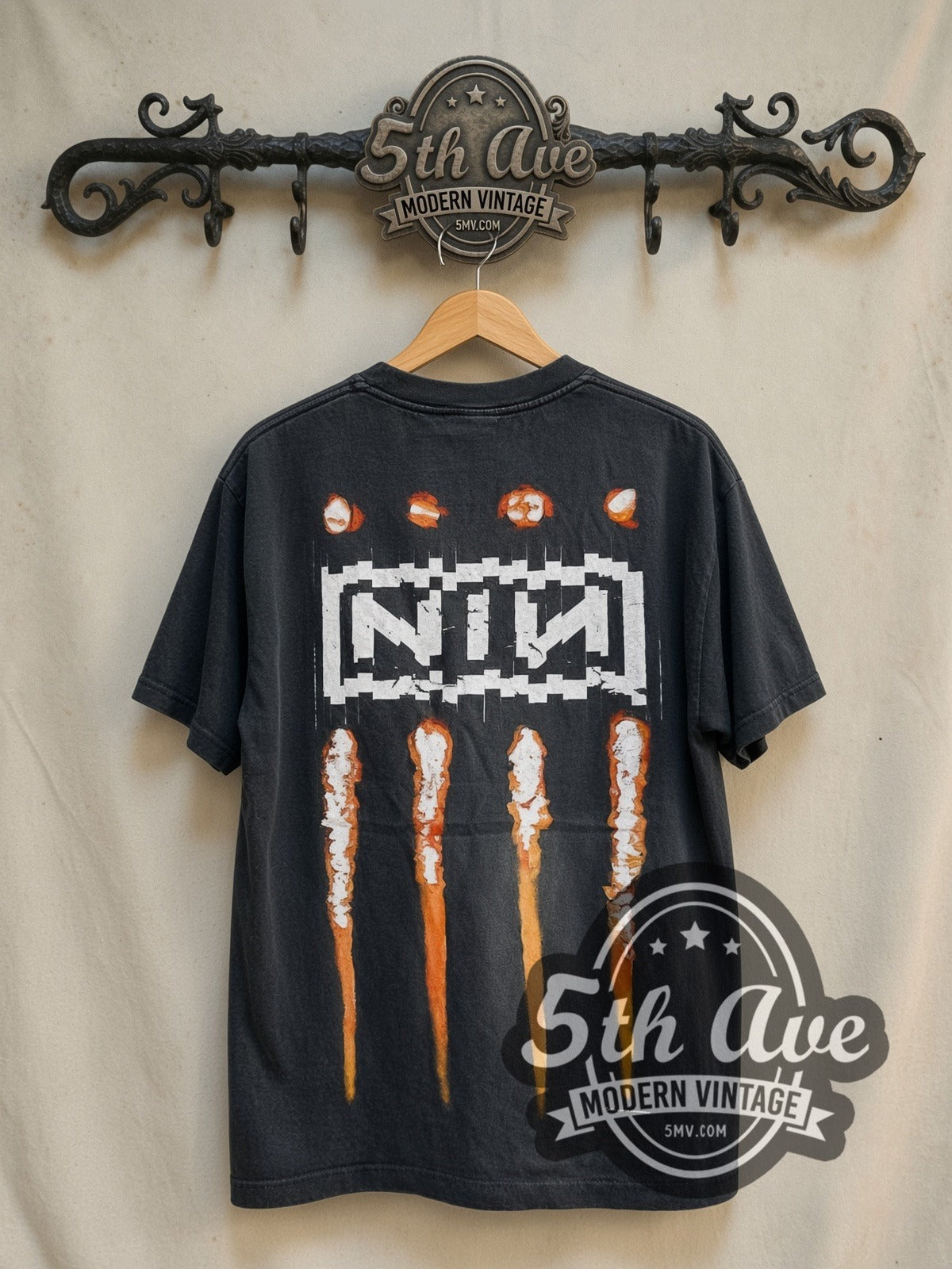 Nine Inch Nails NIИ 'The Downward Spiral' 1994 vintage band t-shirt in black, back view on a display rack