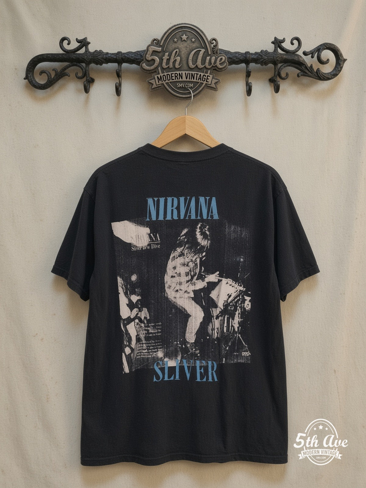 Nirvana – Sliver' Vintage-Inspired Tee: A Distressed Tribute to Grunge Royalty – Vintage Band T-Shirt — back on locked cream ornate 5th Ave rack