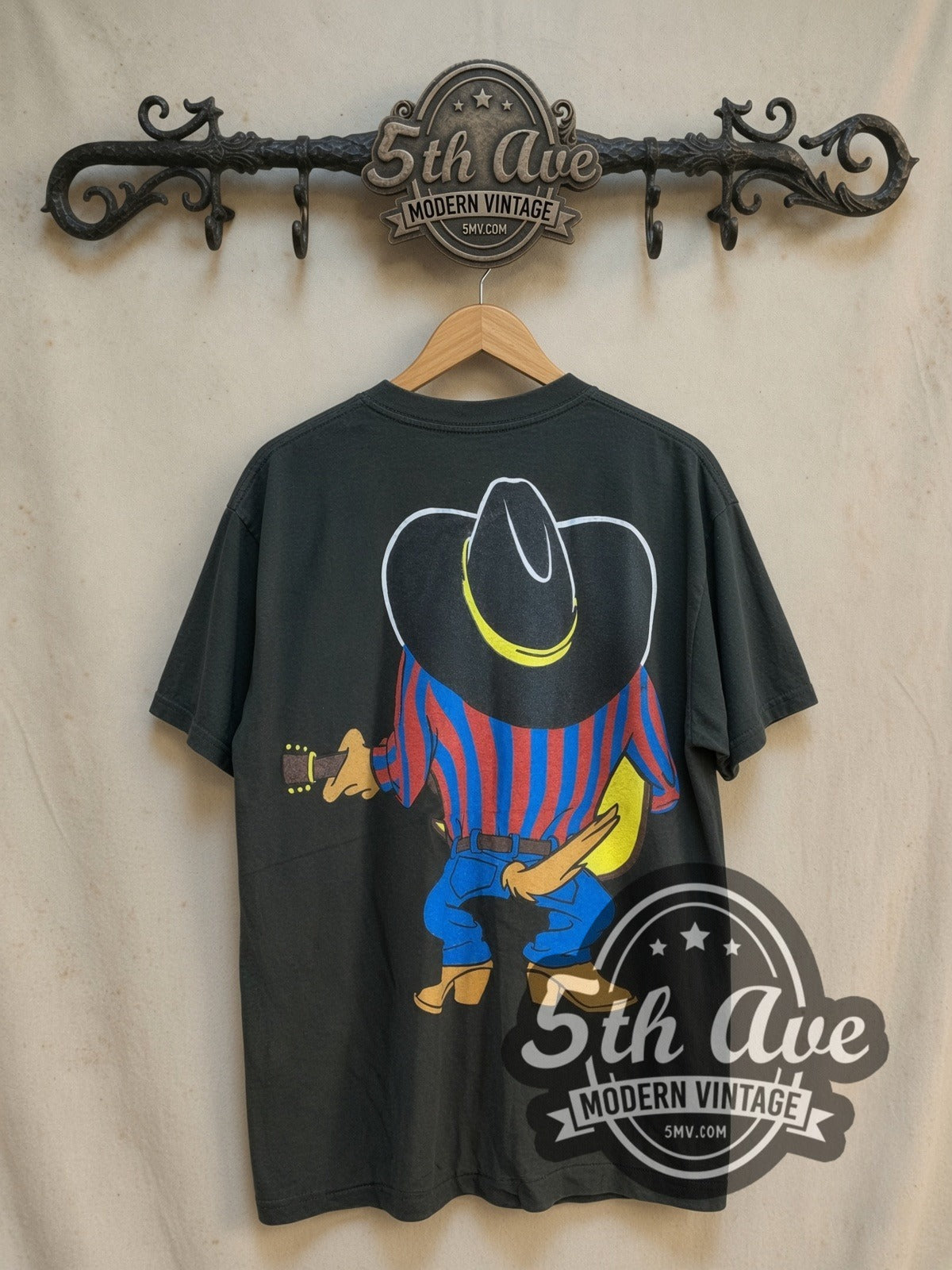 Looney Tunes Taz-Mania all-over-print graphic tee, back view on a display rack