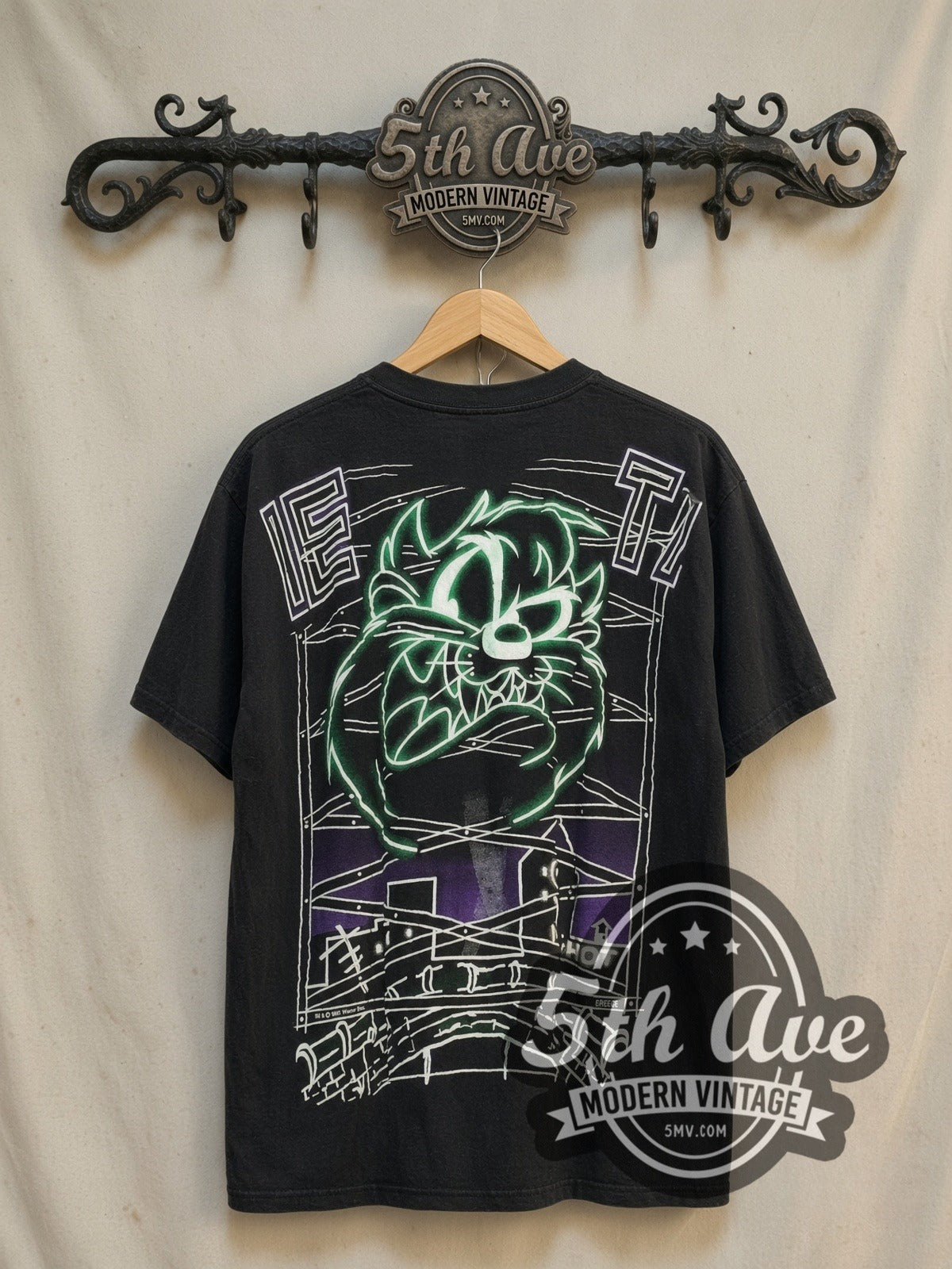 Looney Tunes Taz Mania Retro all-over-print vintage cartoon tee, back view on a display rack