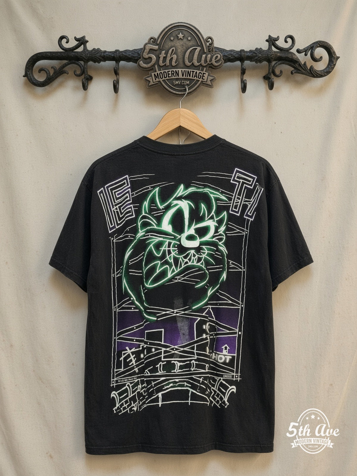 Looney Tunes – Taz Mania Retro AOP Graphic Classic T-Shirt – New Vintage Graphic Tee — back on locked cream ornate 5th Ave rack