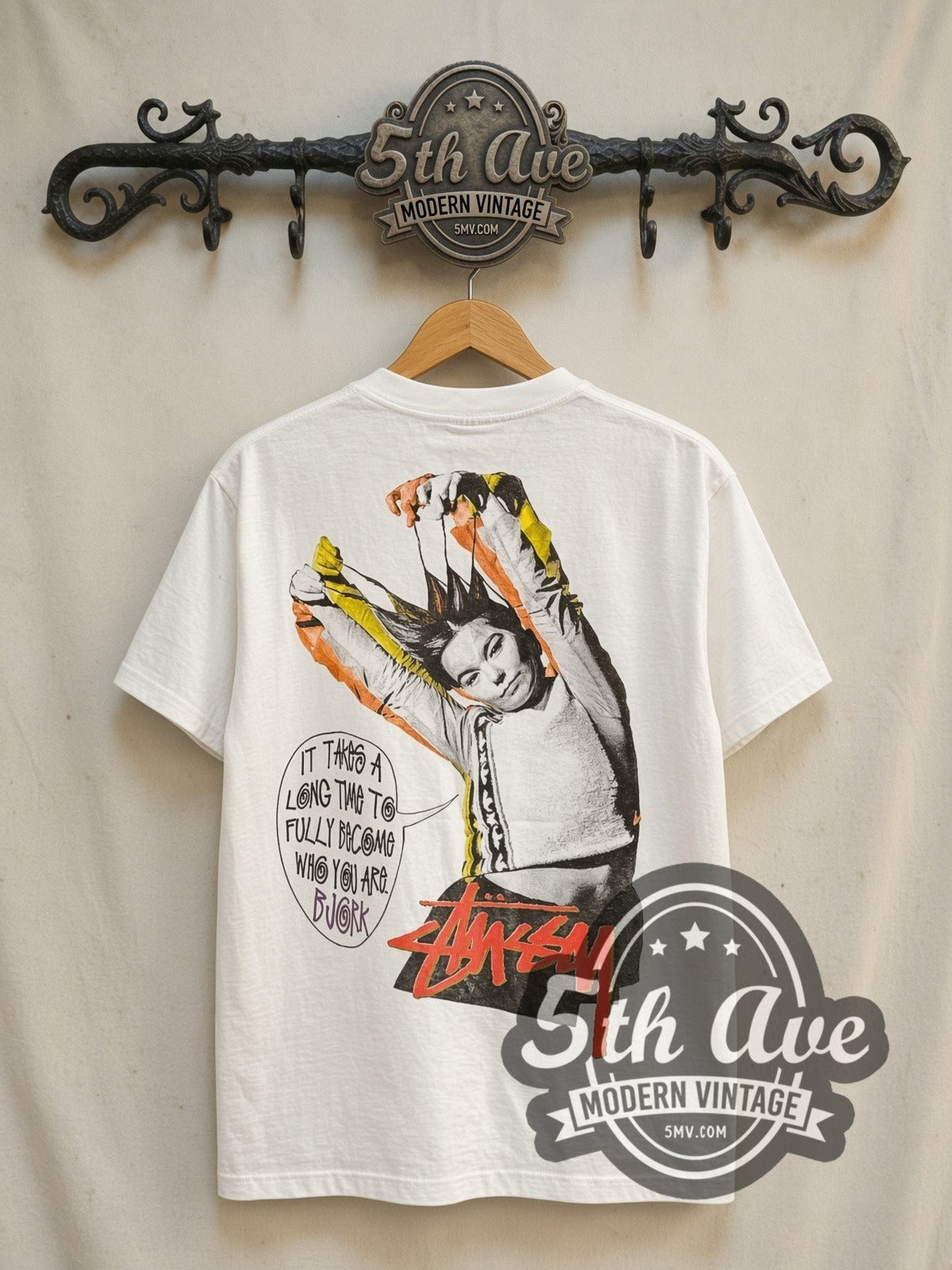 Björk It’s Oh So Quiet graphic tee in white, back view on a display rack