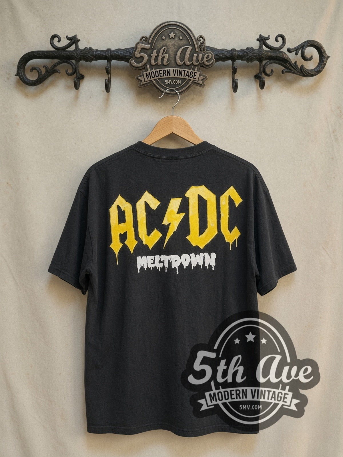 AC/DC Meltdown vintage band t-shirt in black, back view on a display rack
