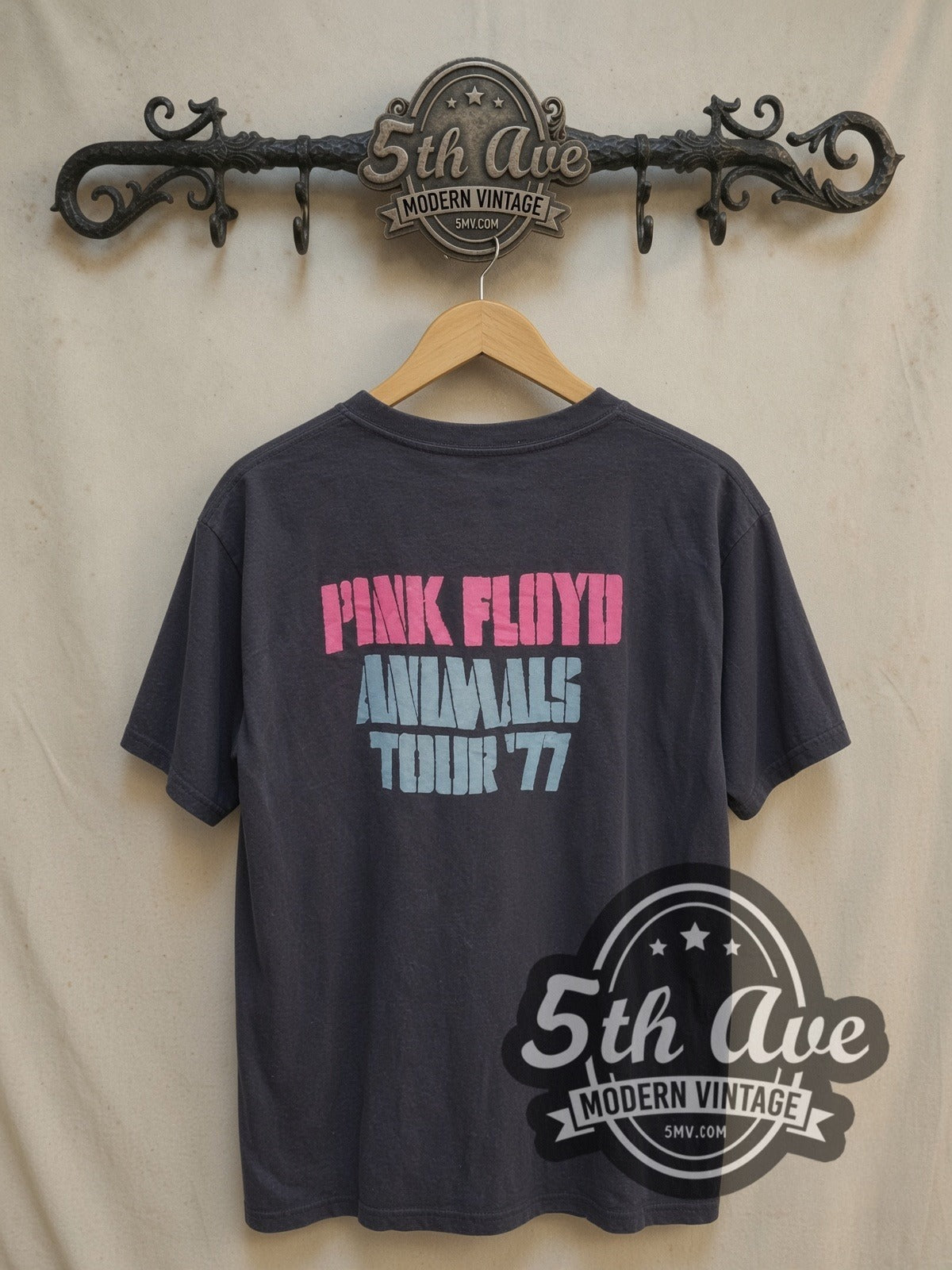 Pink Floyd Animals Red Pink Blue Pig vintage band t-shirt, back view on a display rack