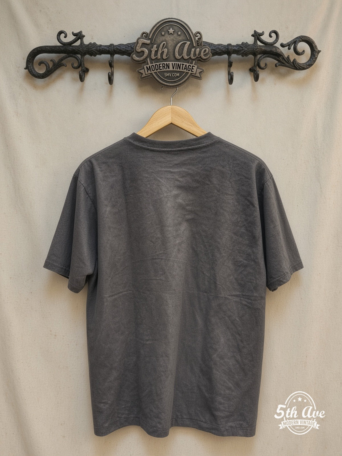 Rock 'n' Roll Reverie: Guns N' Roses Enzyme-Washed Tribute Tee – Vintage Band T-Shirt — back on locked cream ornate 5th Ave rack