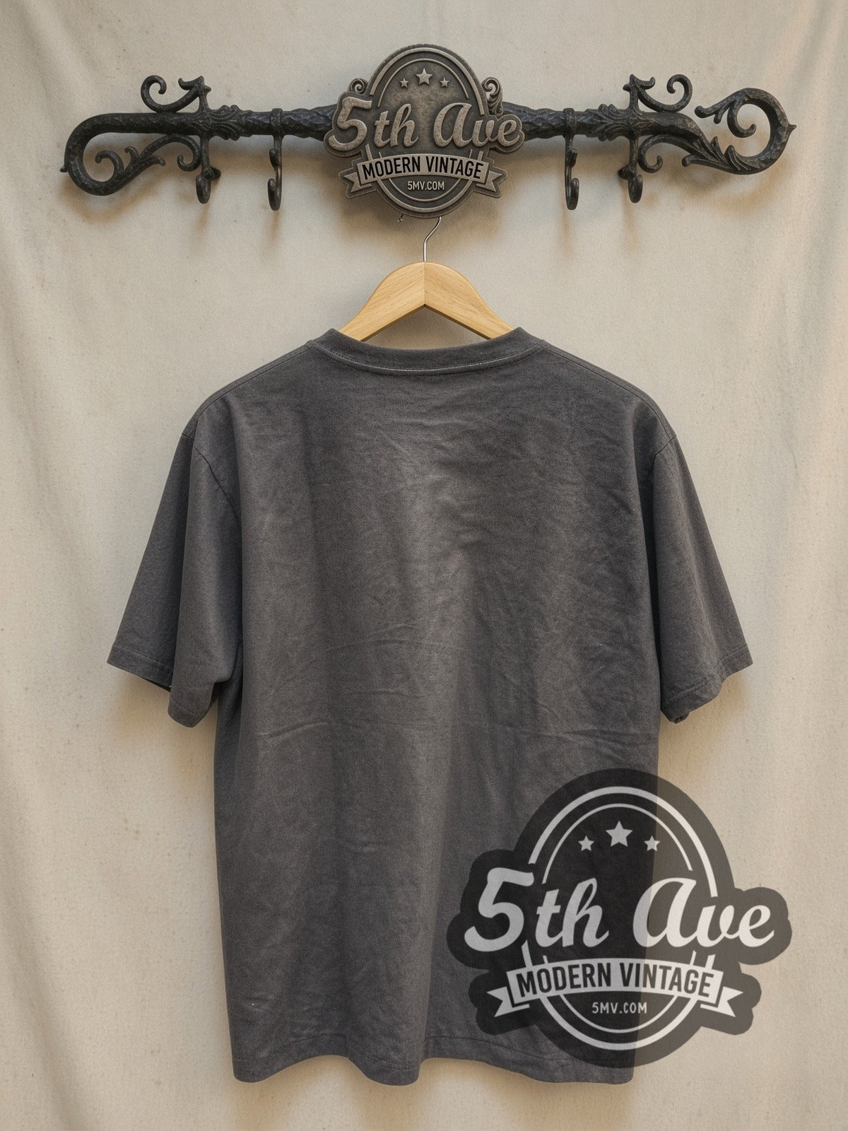 Guns N' Roses Est. 1985 Skull Label vintage band t-shirt, back view on a display rack
