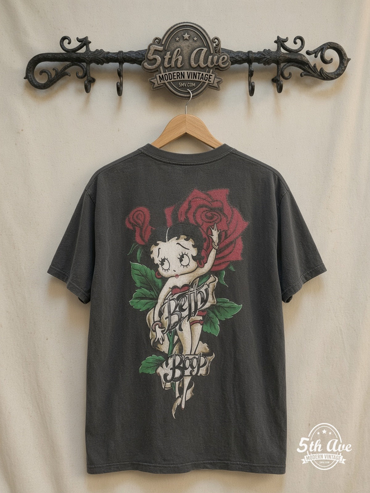 Betty Boop – Cutie Tattoo Roses Black Tee – New Vintage Graphic Tee — back on locked cream ornate 5th Ave rack