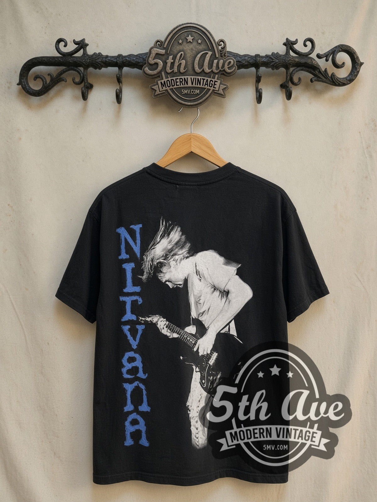 Nirvana Kurt Cobain Blue Logo Play Electric Guitar vintage band t-shirt in black, back view on the 5MV rack
