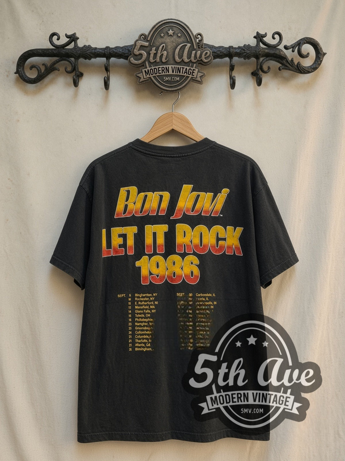 Bon Jovi Slippery When Wet / Let It Rock 1986 vintage band t-shirt in black, back view on a display rack