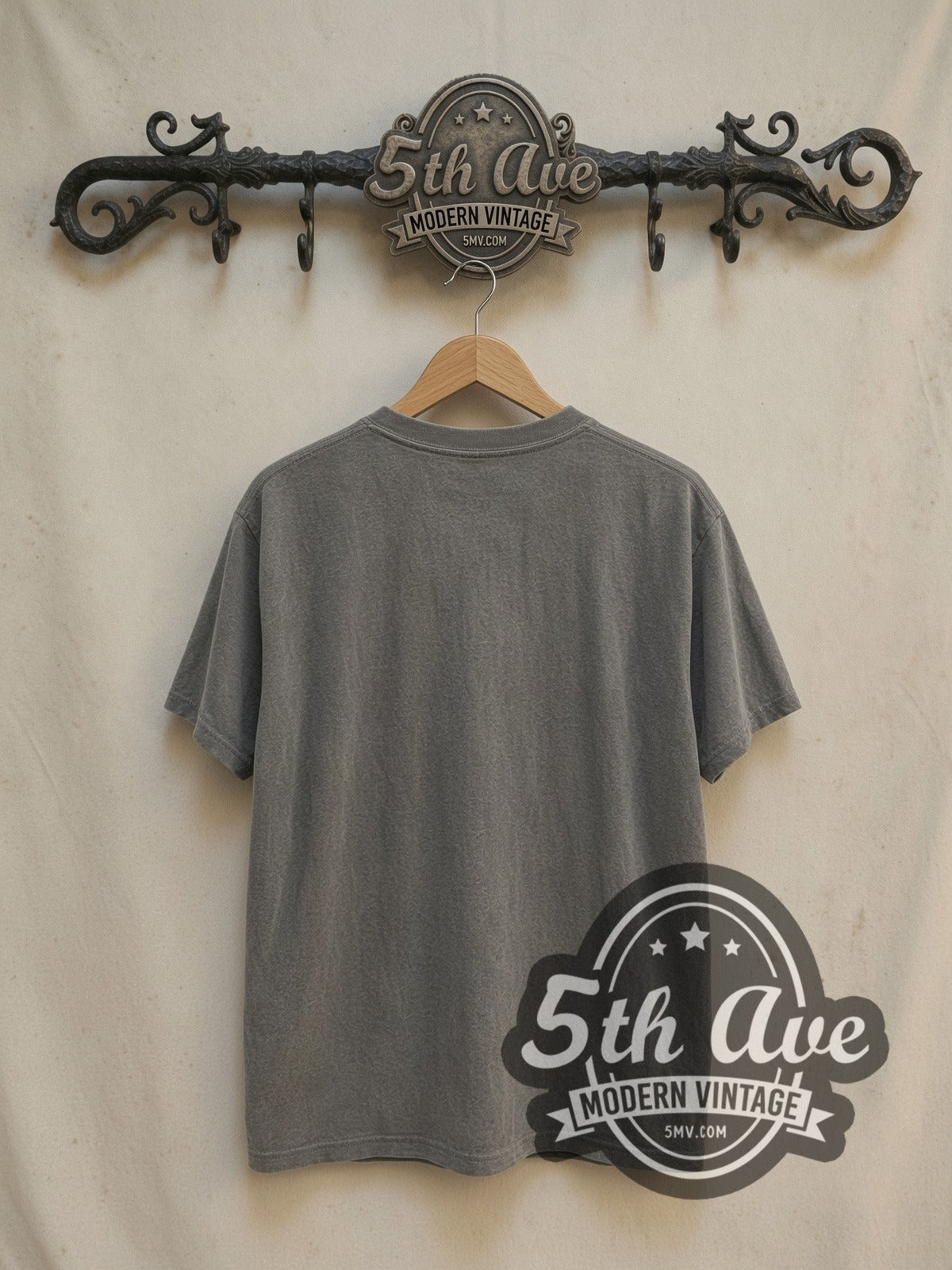 Nirvana In Utero Classic Angel Dark Logo vintage band t-shirt in white, back view on a display rack