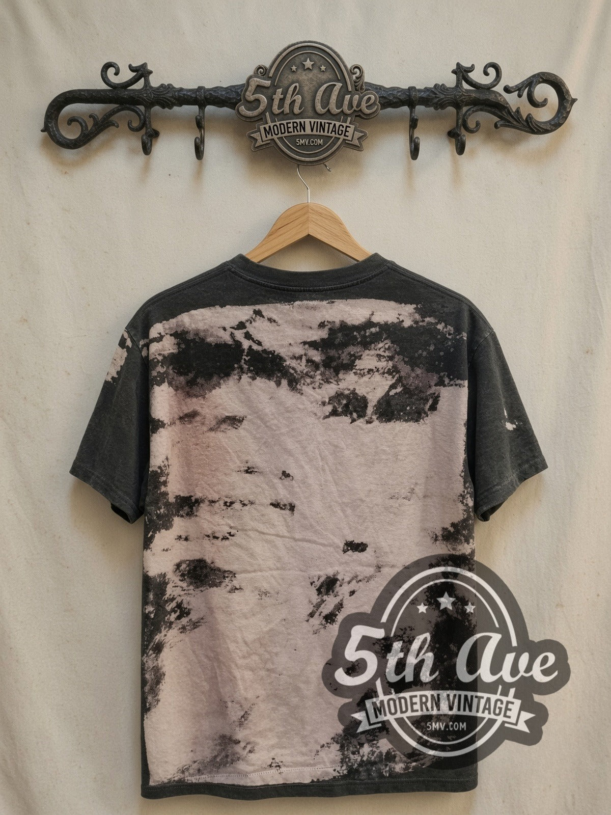 Malcolm X Mosquitohead all-over-print vintage movie t-shirt, back view on a display rack
