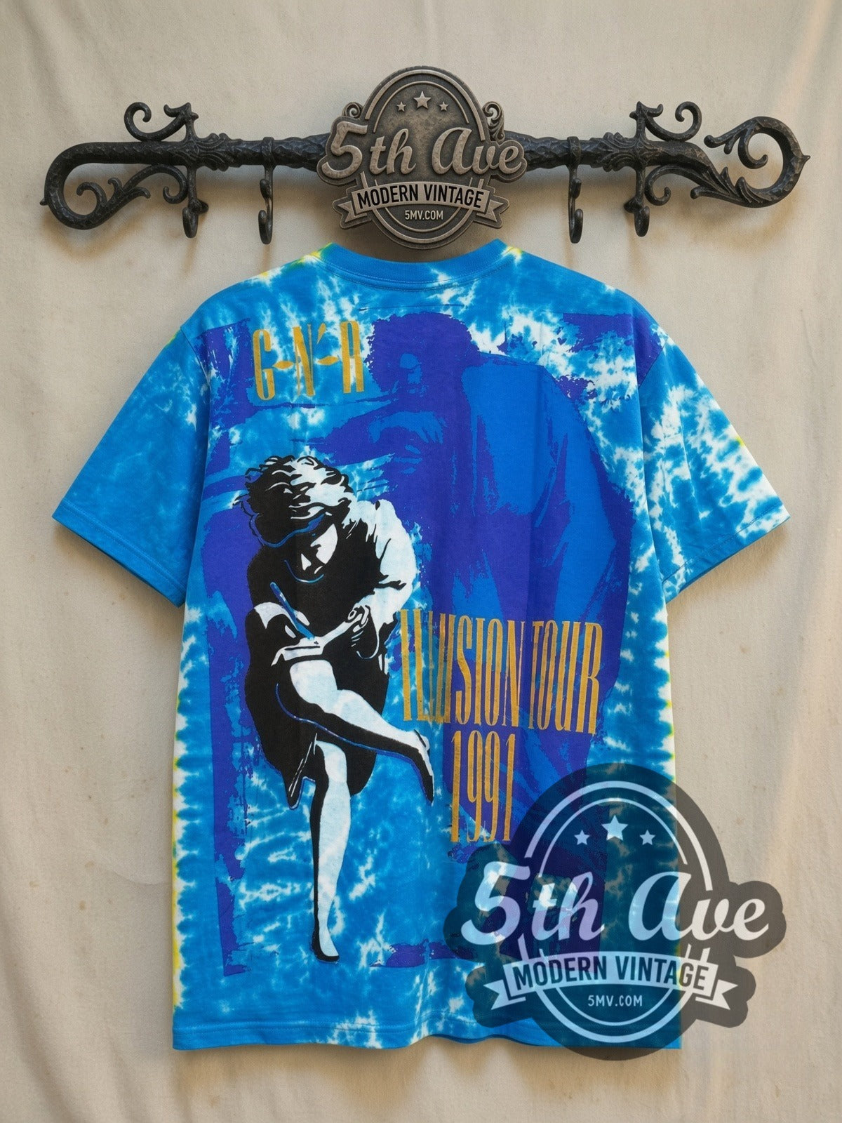 Guns N' Roses Use Your Illusion Tour vintage band t-shirt, back view on a display rack