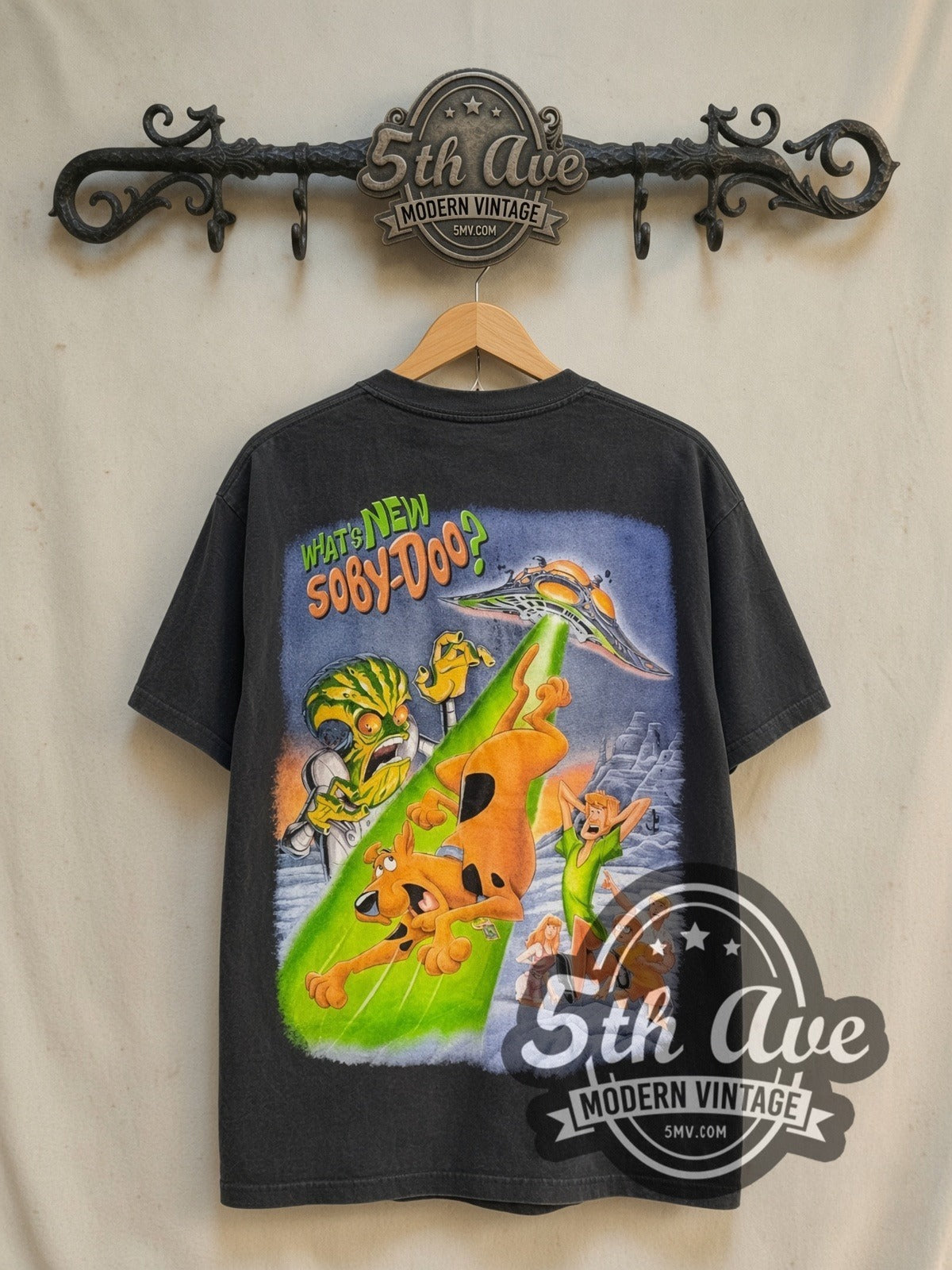 Scooby-Doo Cyber Chase all-over-print vintage cartoon tee in black, back view on a display rack