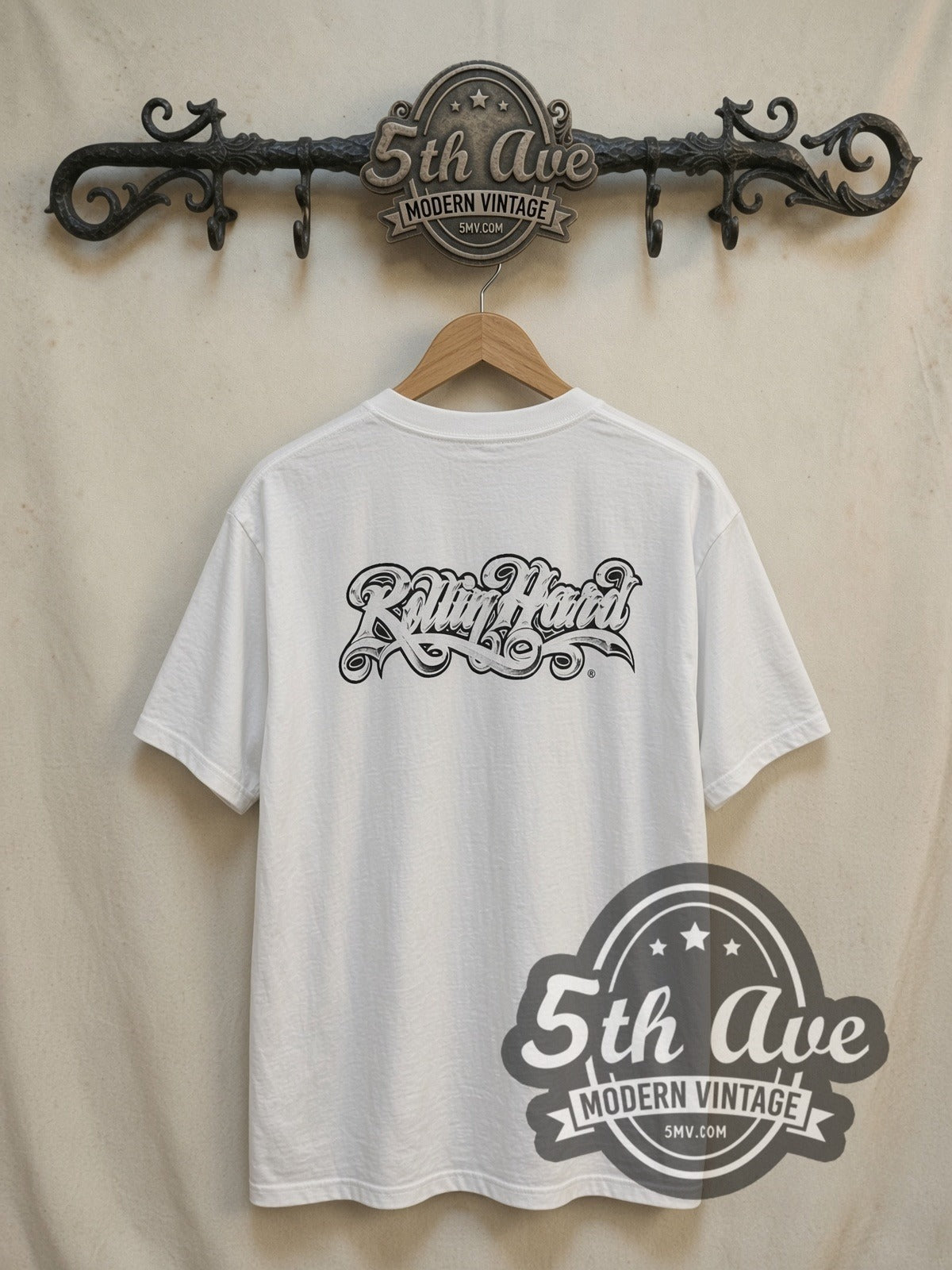 Rollin Hard '65 Impala Lowrider vintage graphic tee, back view on a display rack