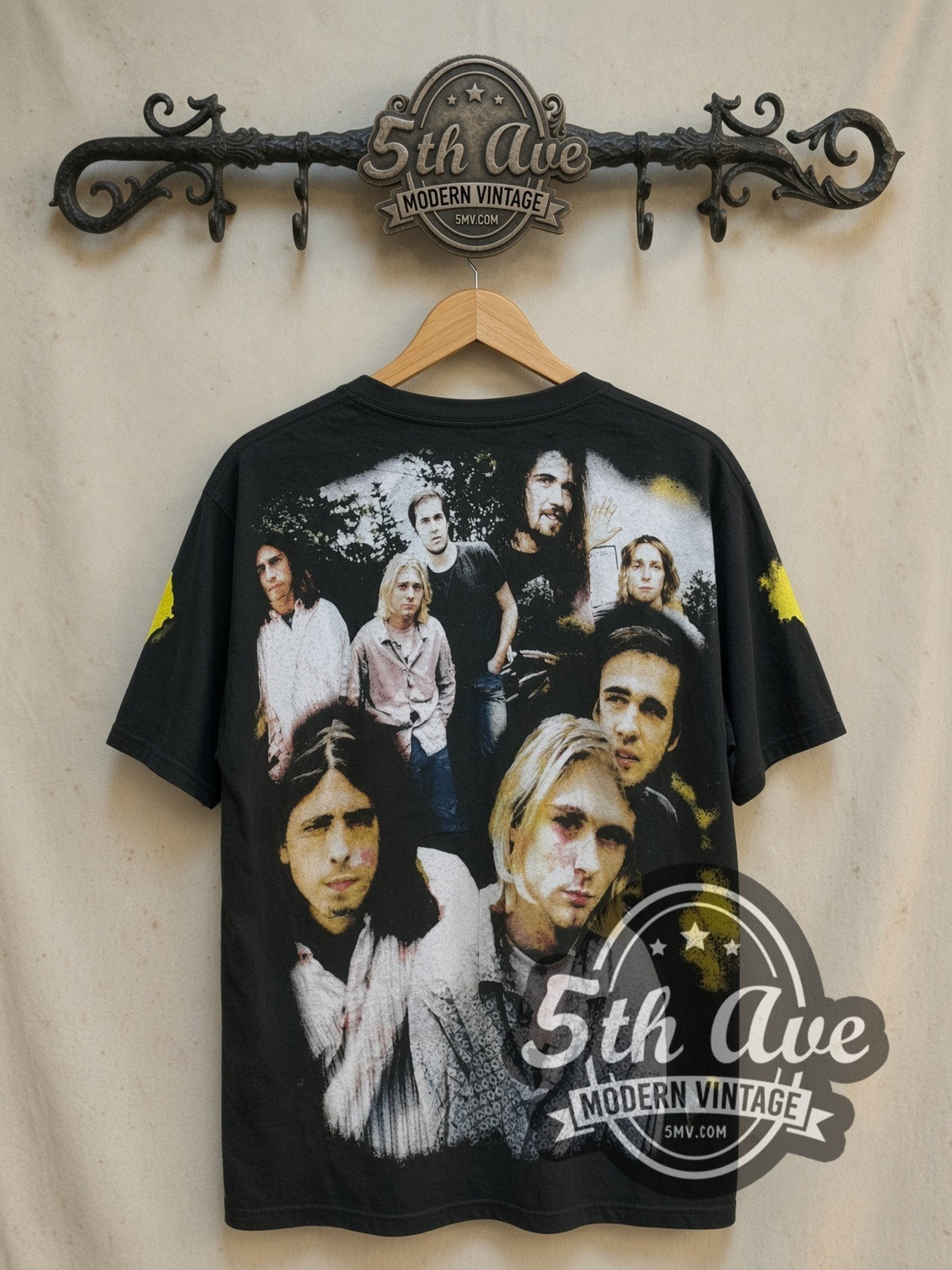 Nirvana Kurt Cobain Photo Collage all-over-print vintage band t-shirt, back view on a display rack