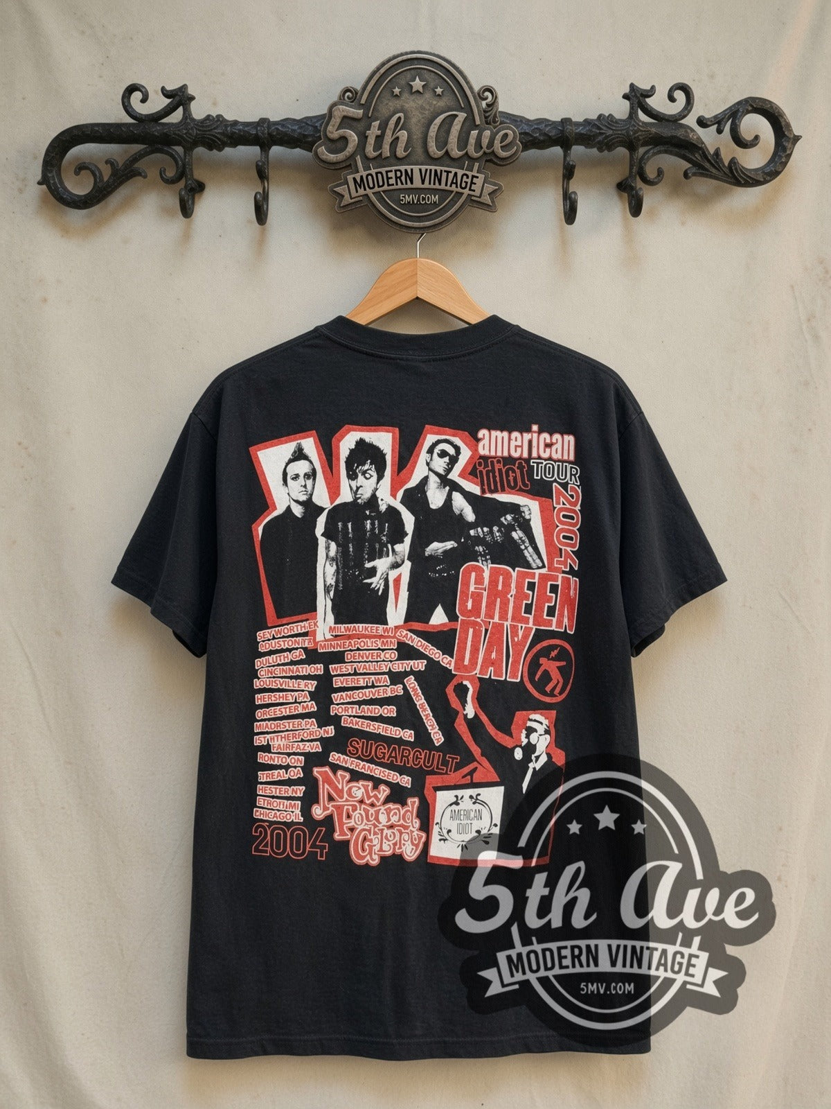 Green Day American Idiot Tour 2004 vintage band t-shirt in black, back view on a display rack