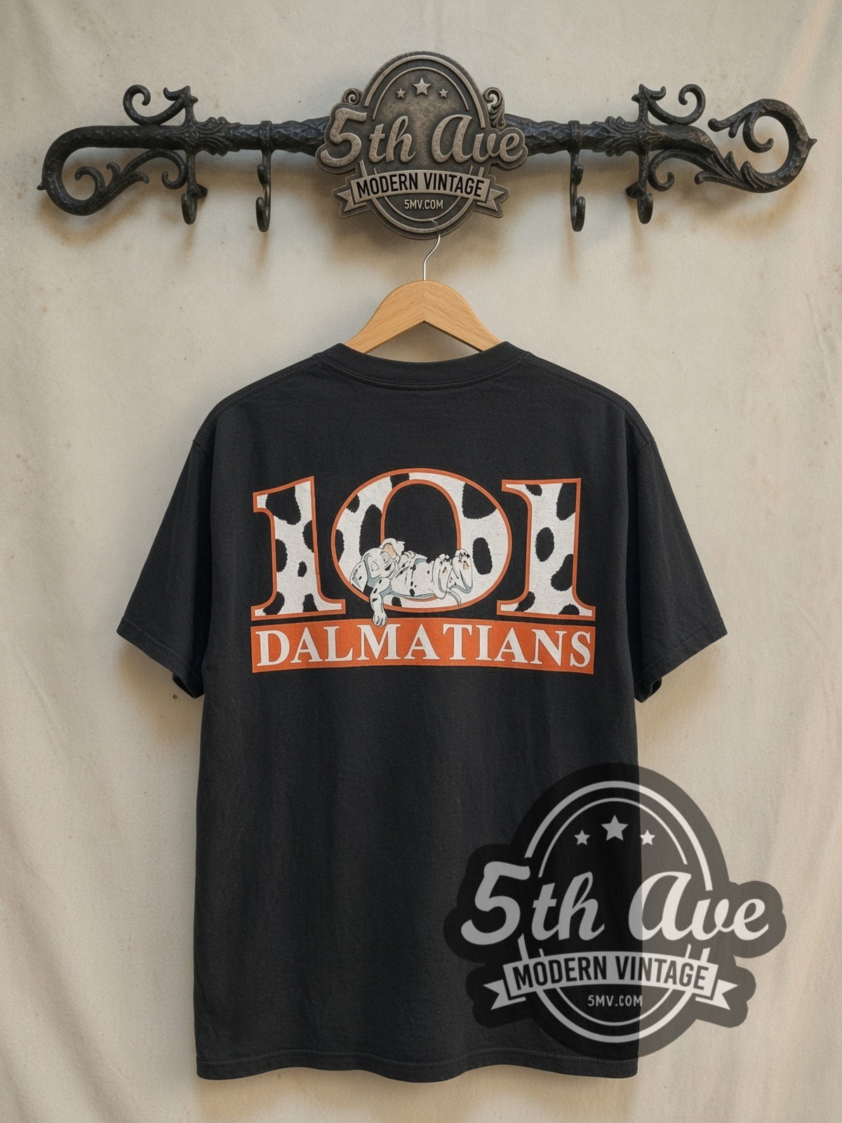 101 Dalmatians 101 Puppies Pile vintage cartoon tee in black, back view on a display rack