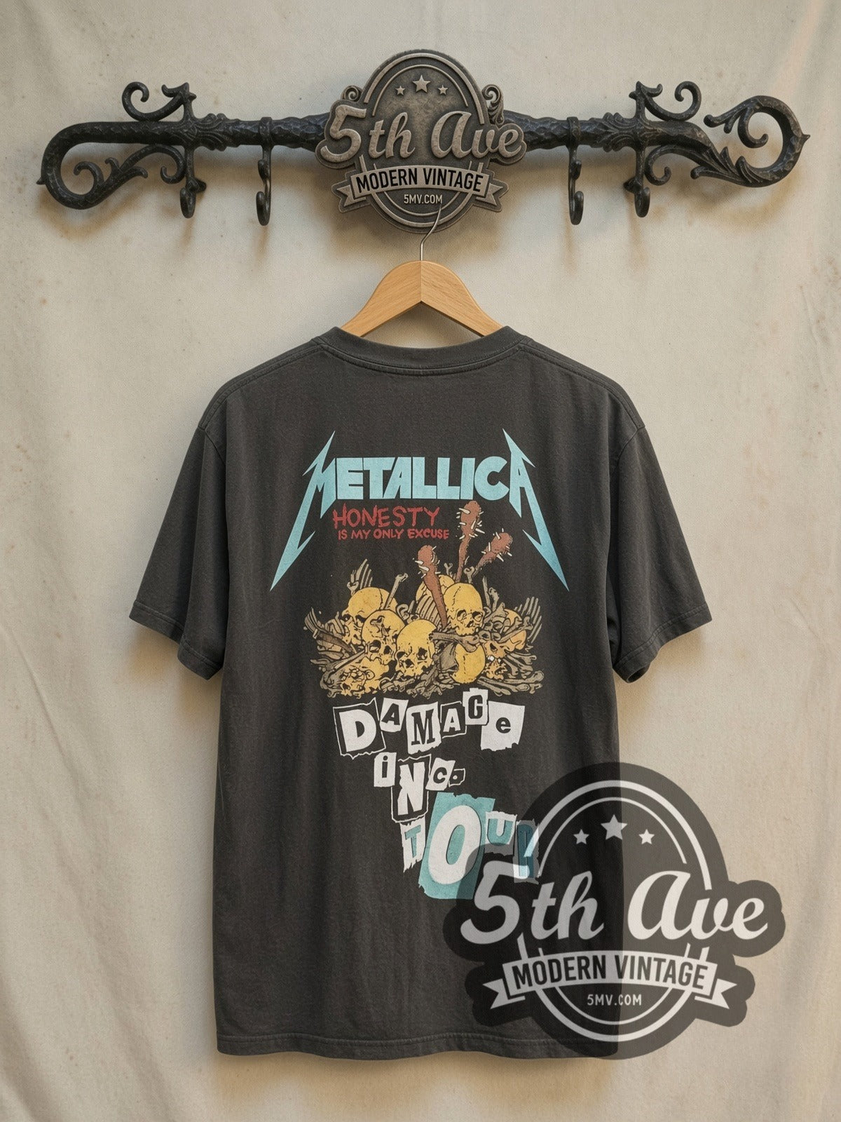 Metallica Damage Inc. Red Crown Pushead Skull vintage band t-shirt, back view on a display rack