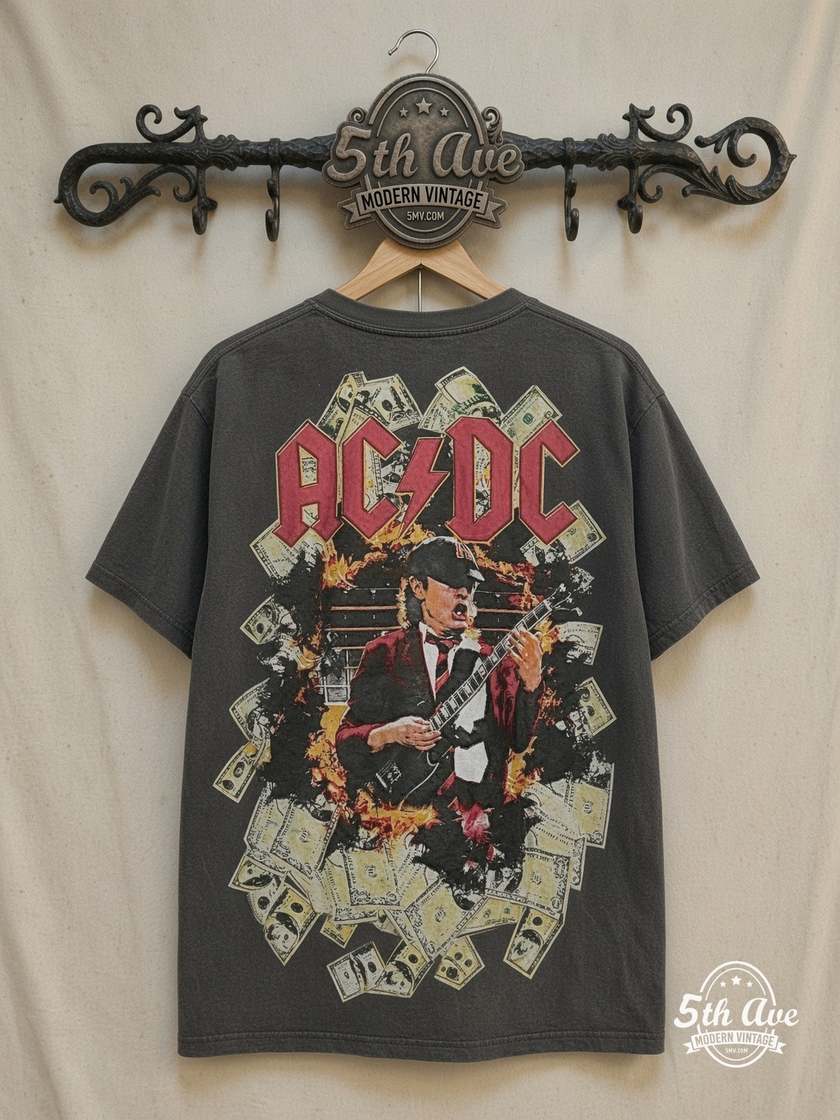 AC/DC – Electrifying Energy: AC/DC All Over Print Single Stitch White t shirt – Vintage Band T-Shirt — back on locked cream ornate 5th Ave rack
