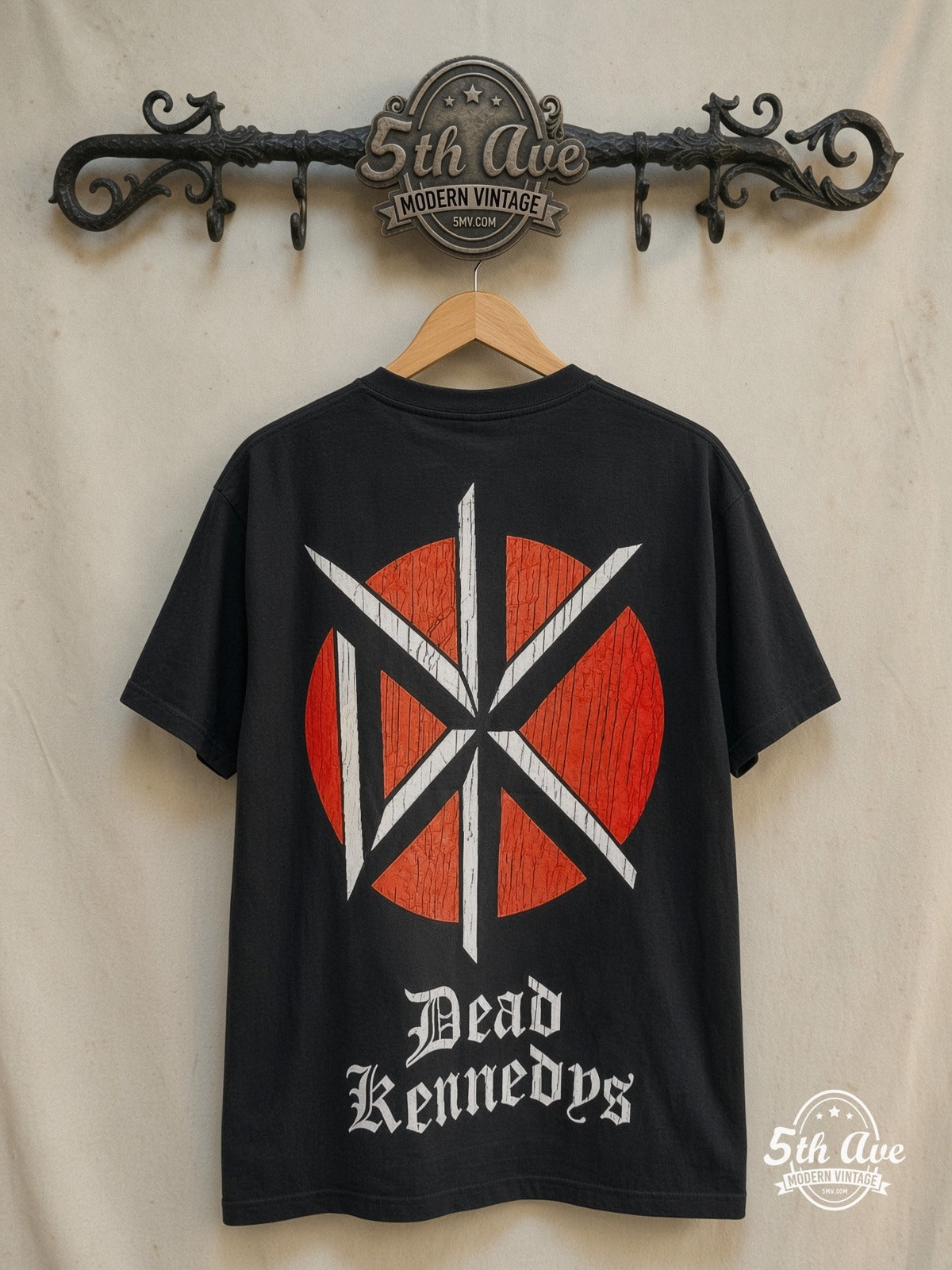 Dead Kennedys – Holiday in Cambodia – Vintage Band T-Shirt — back on locked cream ornate 5th Ave rack