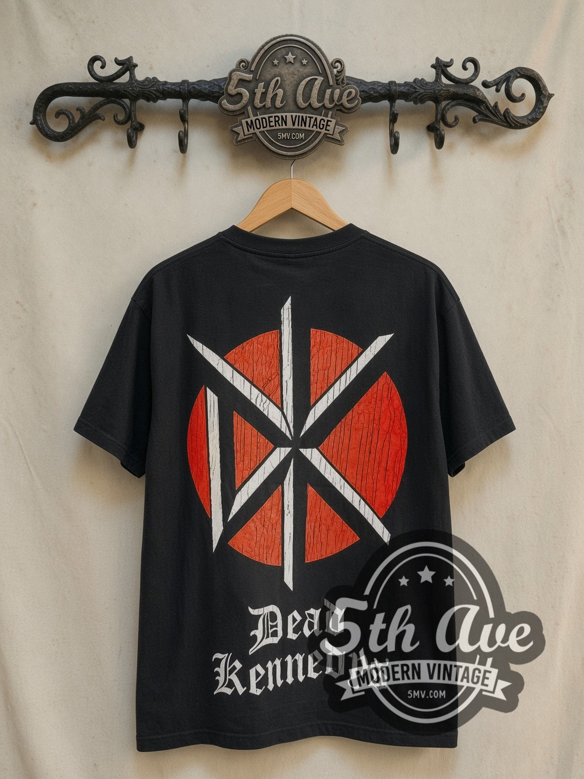 Dead Kennedys Holiday in Cambodia vintage band t-shirt in black, back view on a display rack