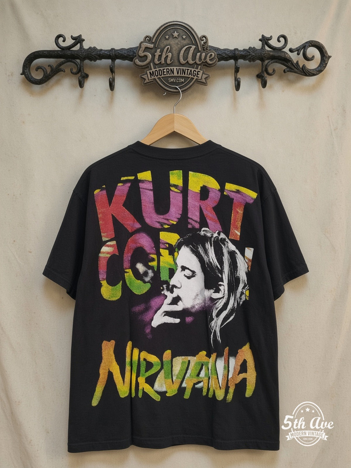 Nirvana – Nirvana T-Shirt Iconic Rock Band Graphic – Vintage Band T-Shirt — back on locked cream ornate 5th Ave rack