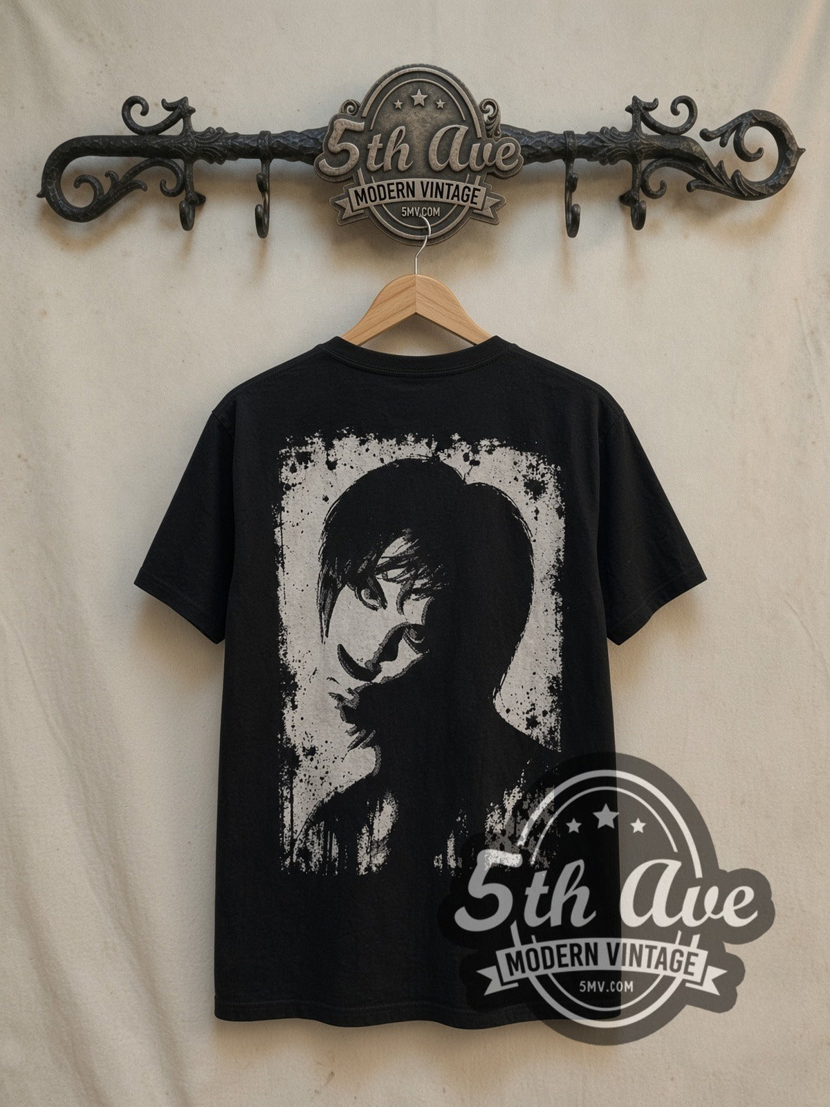 The Cure all-over-print vintage band t-shirt, back view on a display rack