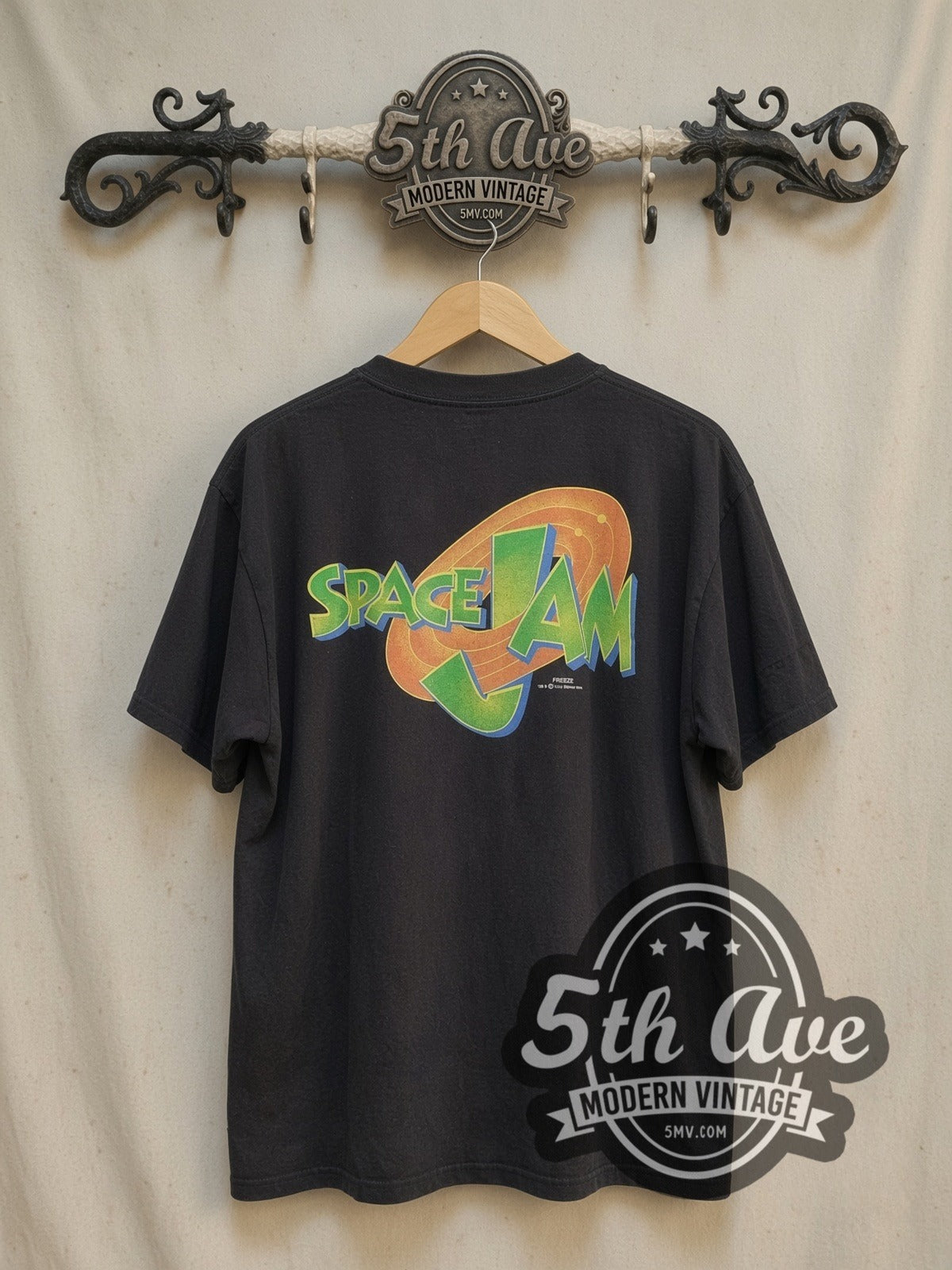 Looney Tunes Space Jam all-over-print vintage cartoon tee, back view on a display rack