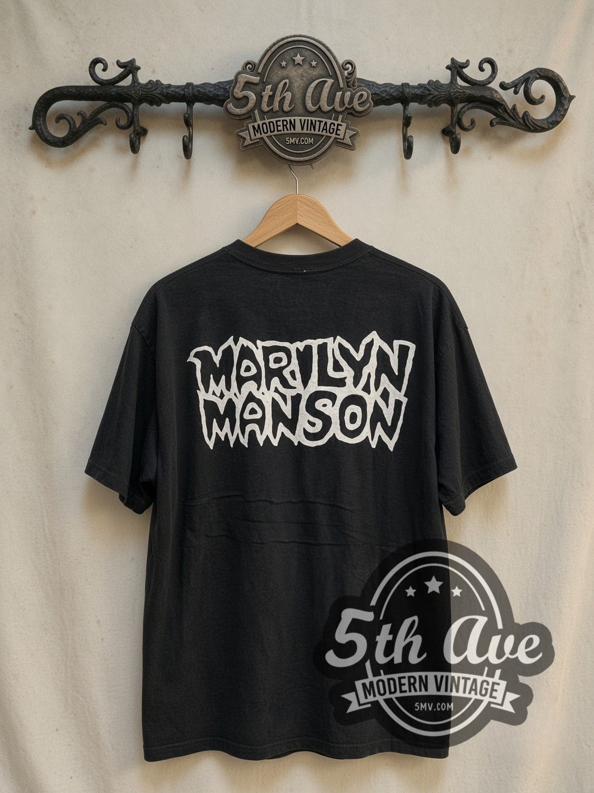 Marilyn Manson Dope Hat vintage band t-shirt in black, back view on a display rack