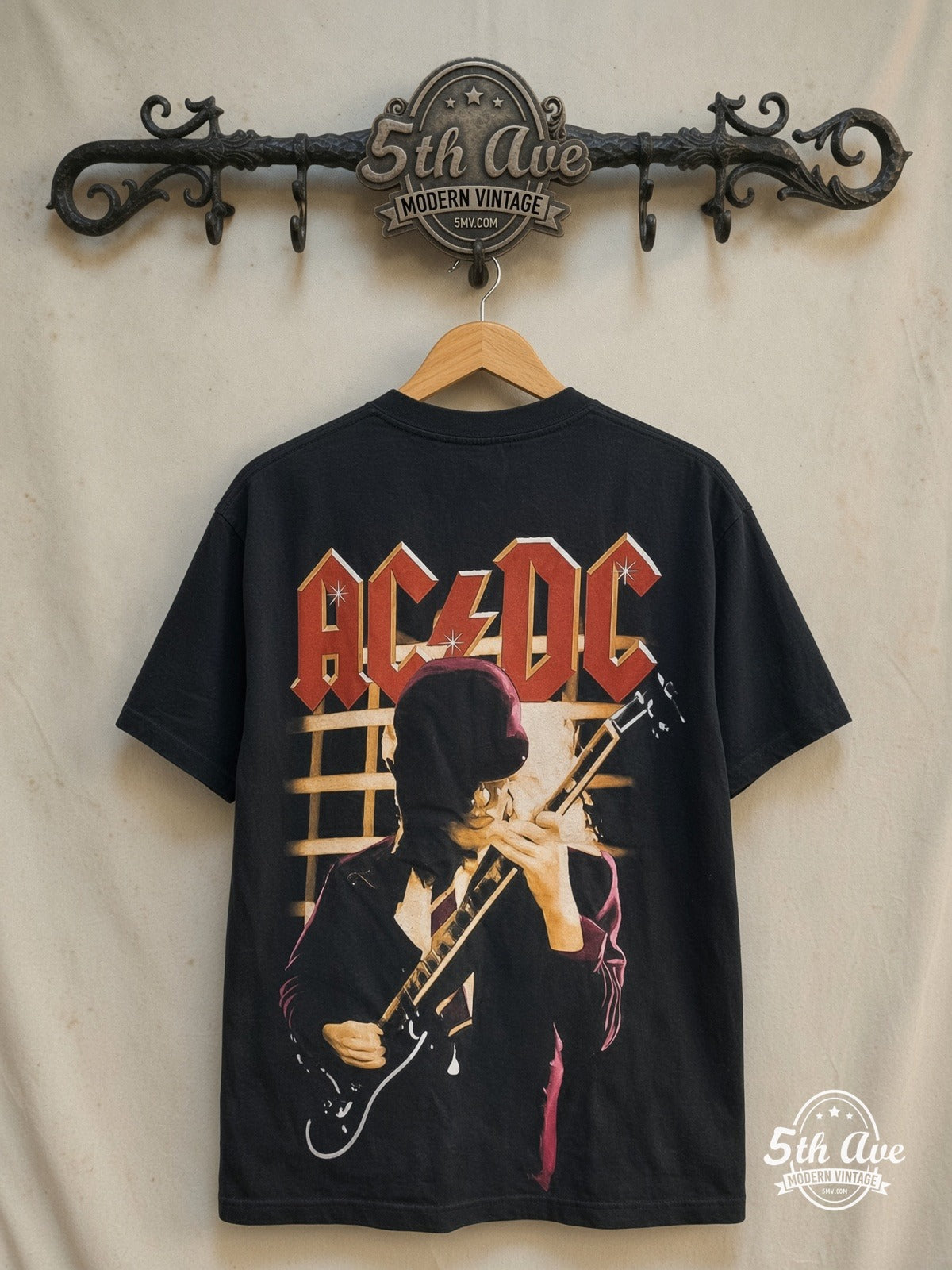 AC/DC – Angus Young Guitar Solo – All Over Print – Vintage Band T-Shirt — back on locked cream ornate 5th Ave rack