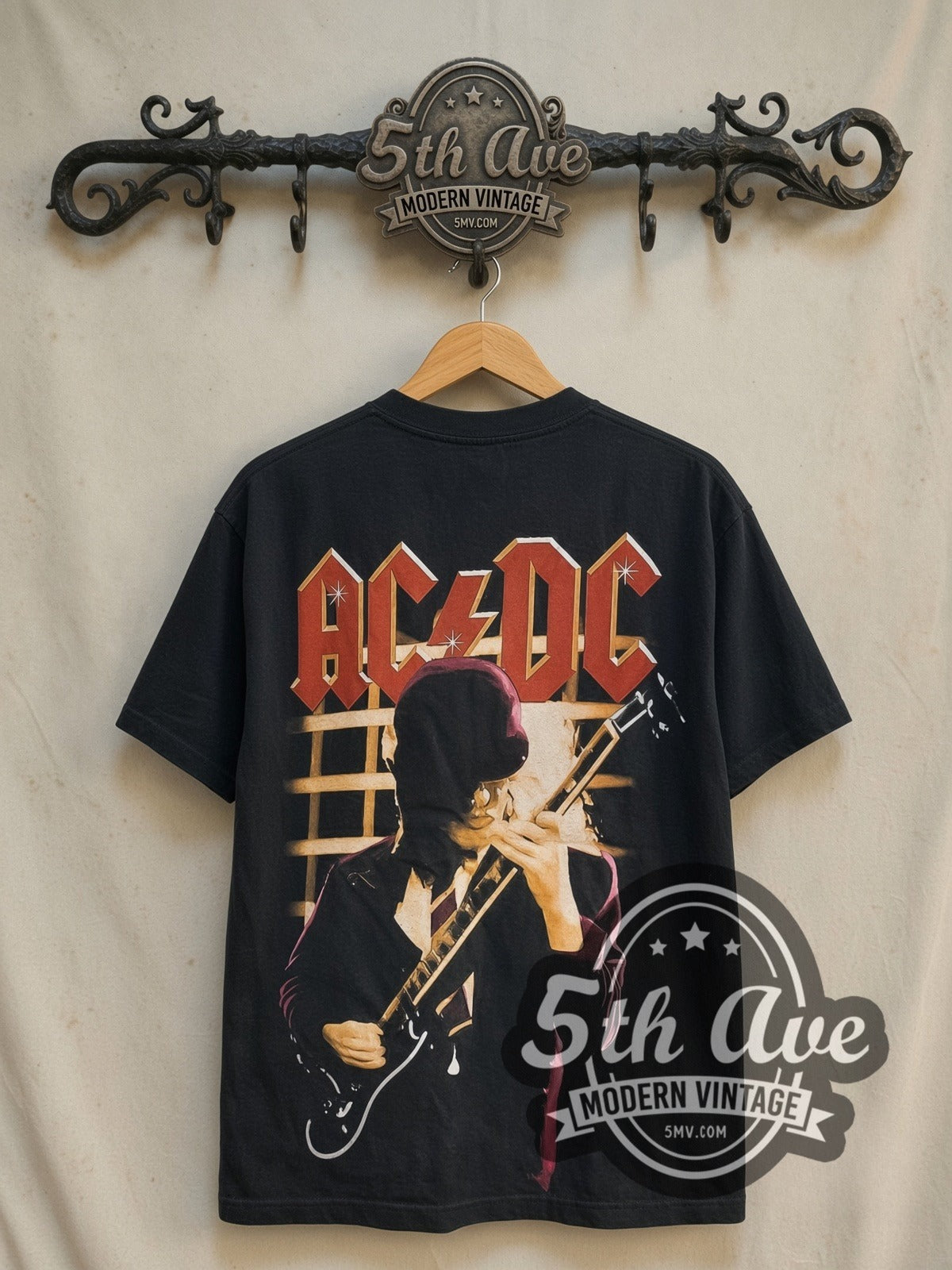 AC/DC Angus Young Guitar Solo all-over-print vintage band t-shirt in black, back view on a display rack