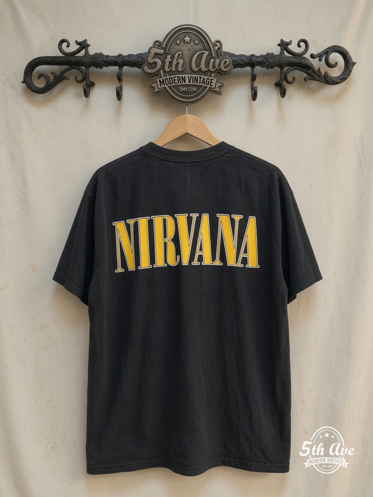 Nirvana – All Apologies – Vintage Band T-Shirt — back on locked cream ornate 5th Ave rack