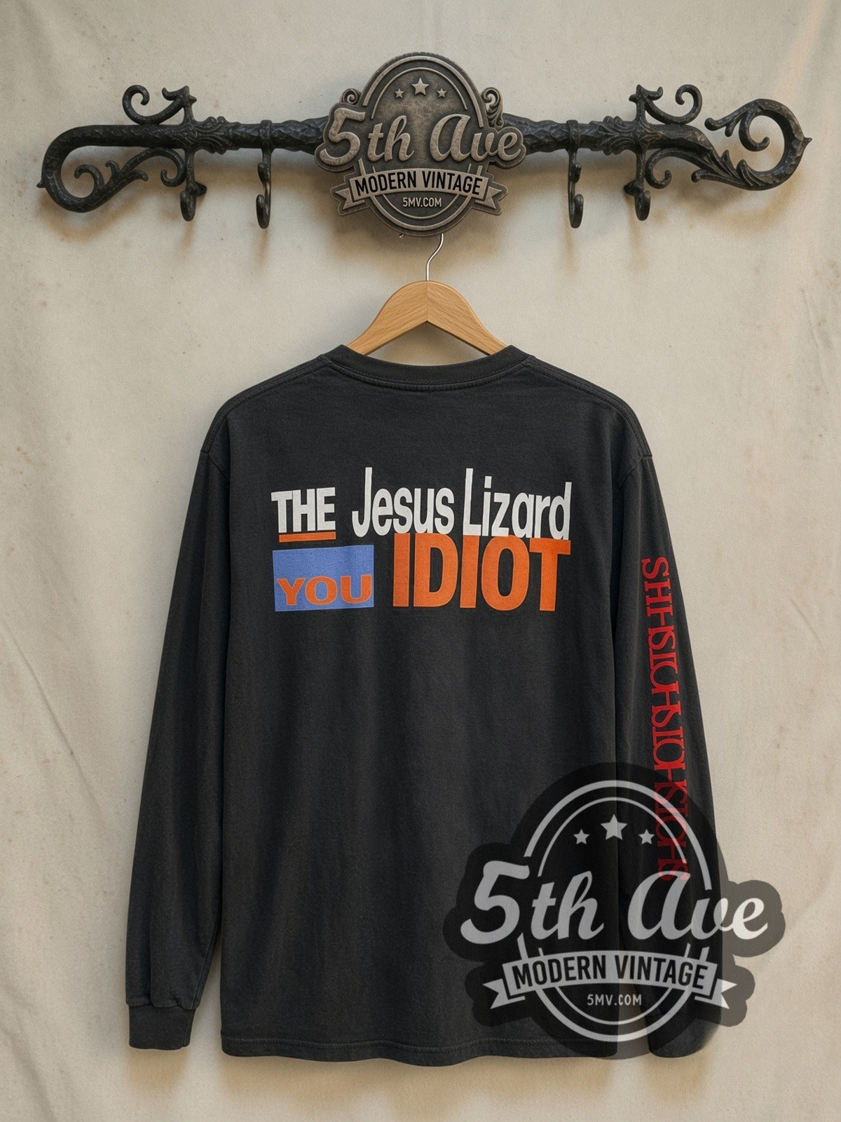 The Jesus Lizard You Idiot vintage band long sleeve t-shirt, back view on a display rack