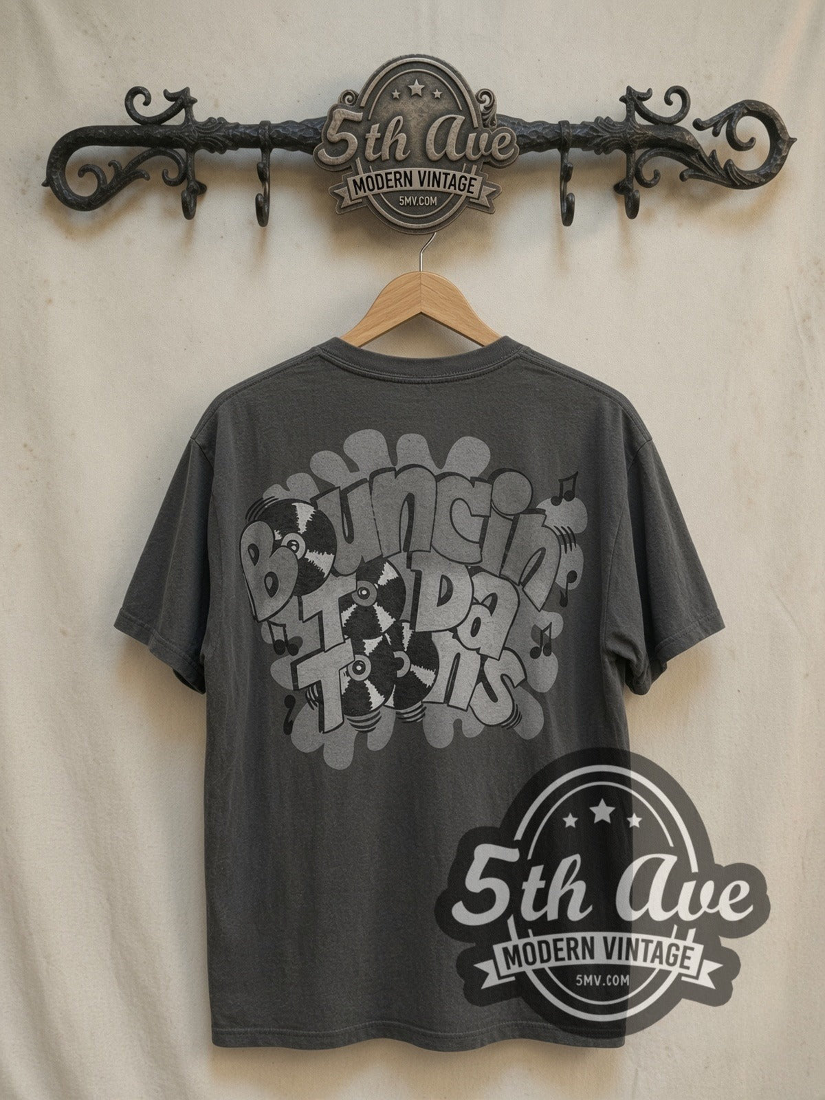 Looney Tunes all-over-print vintage cartoon tee, back view on a display rack