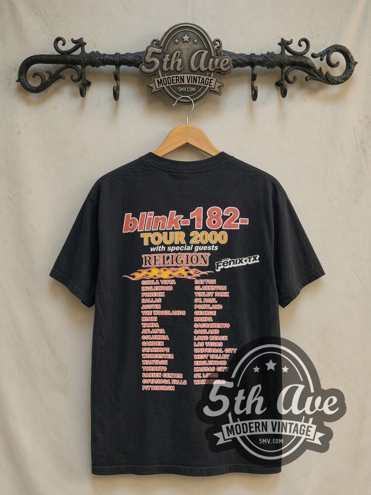 Blink-182 The Mark, Tom and Travis Show vintage band t-shirt in black, back view on a display rack