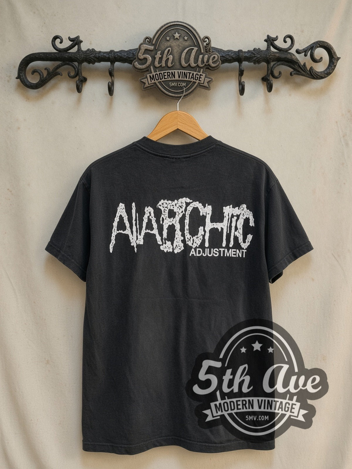 Anarchic Adjustment Freedom vintage graphic t-shirt, back view on a display rack