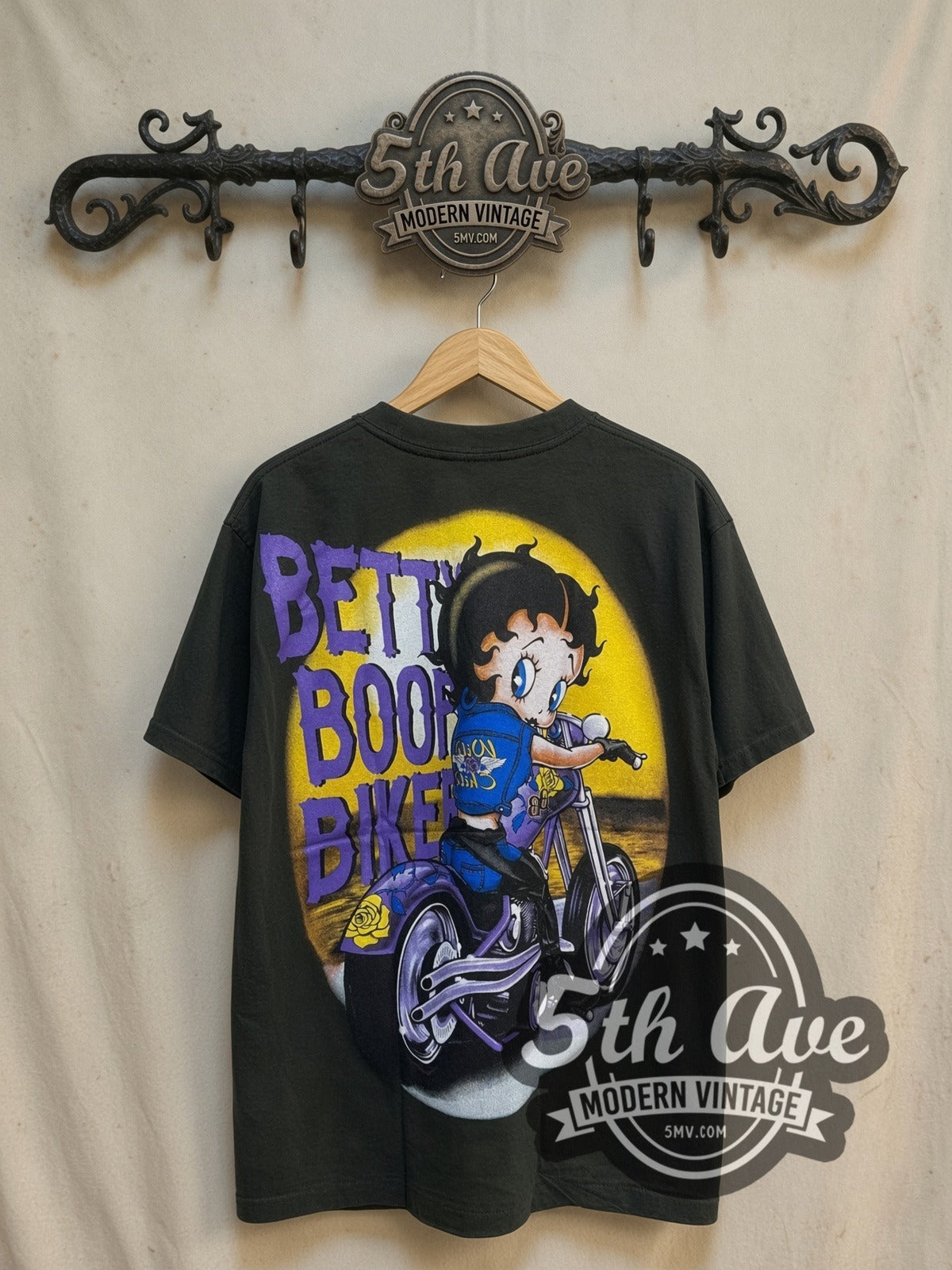 Betty Boop Born to Be Wild Biker graphic tee, back view on a display rack