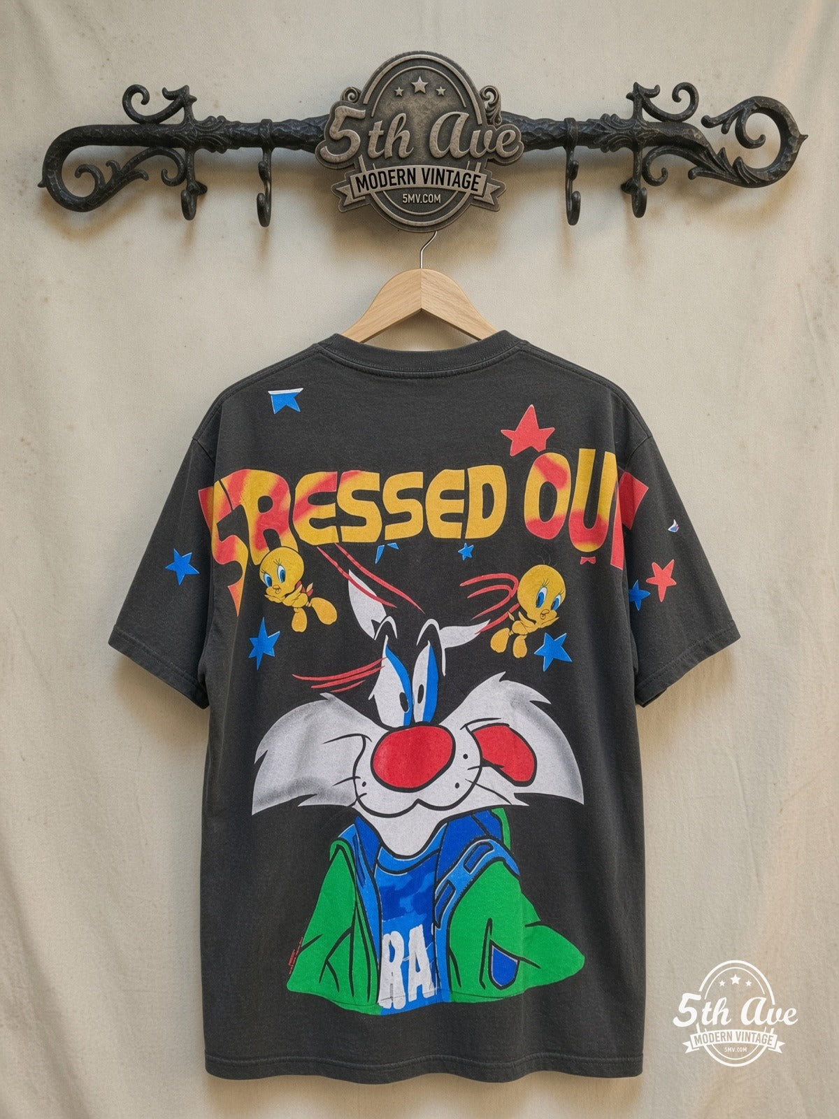Looney Tunes – Sylvester and Tweety – All Over Print – New Vintage Graphic Tee — back on locked cream ornate 5th Ave rack