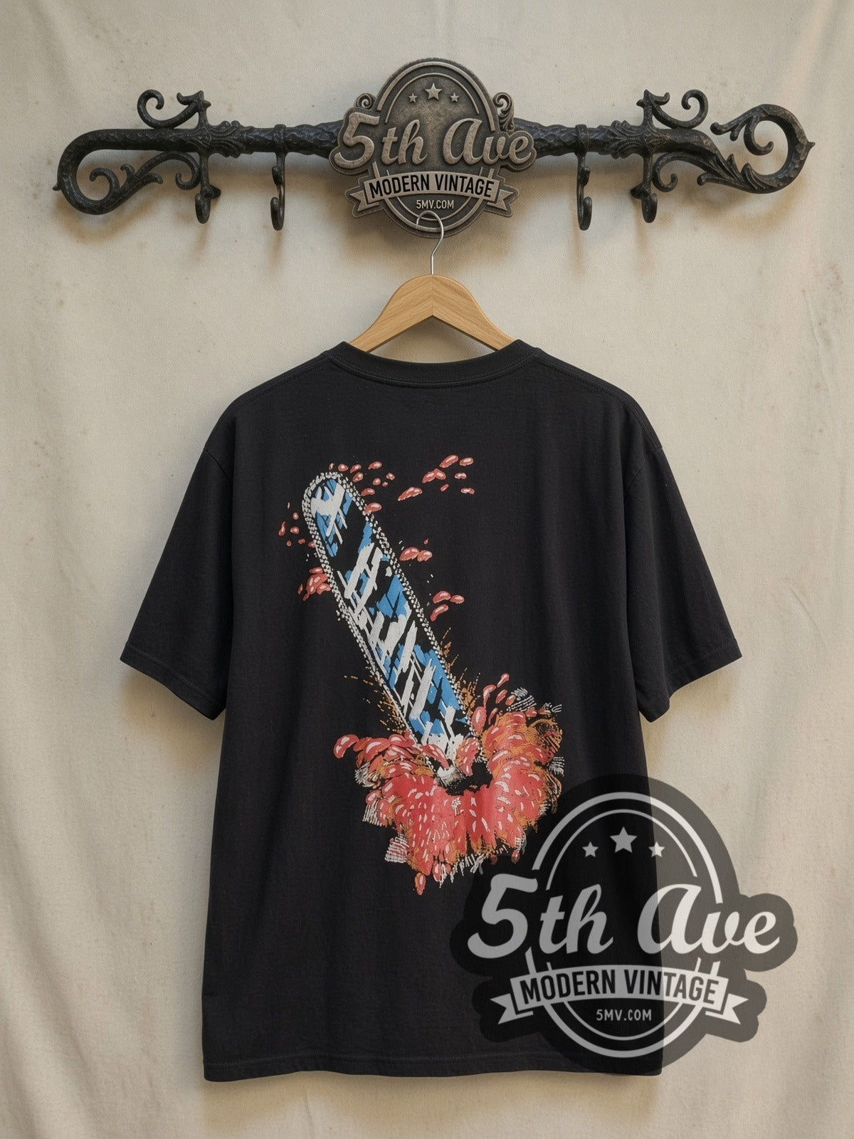 Texas Chainsaw Massacre vintage graphic t-shirt, back view on a display rack