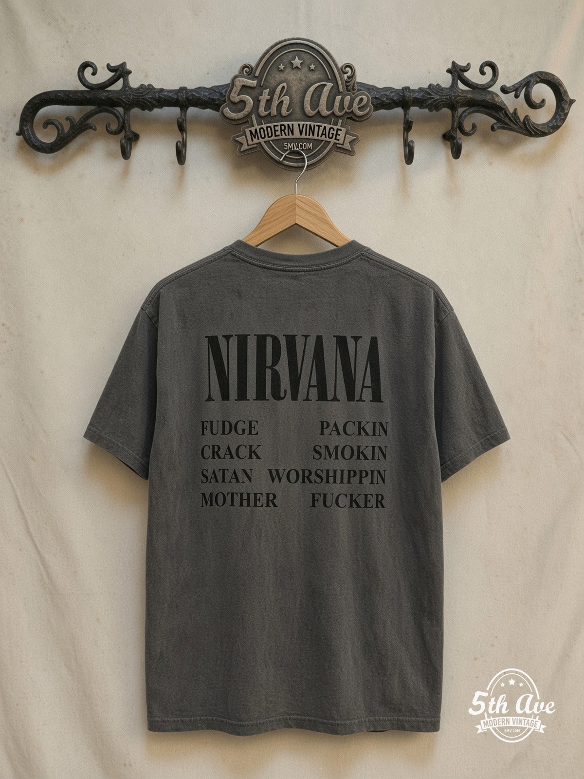 Nirvana – Insecticide – Vintage Band T-Shirt — back on locked cream ornate 5th Ave rack