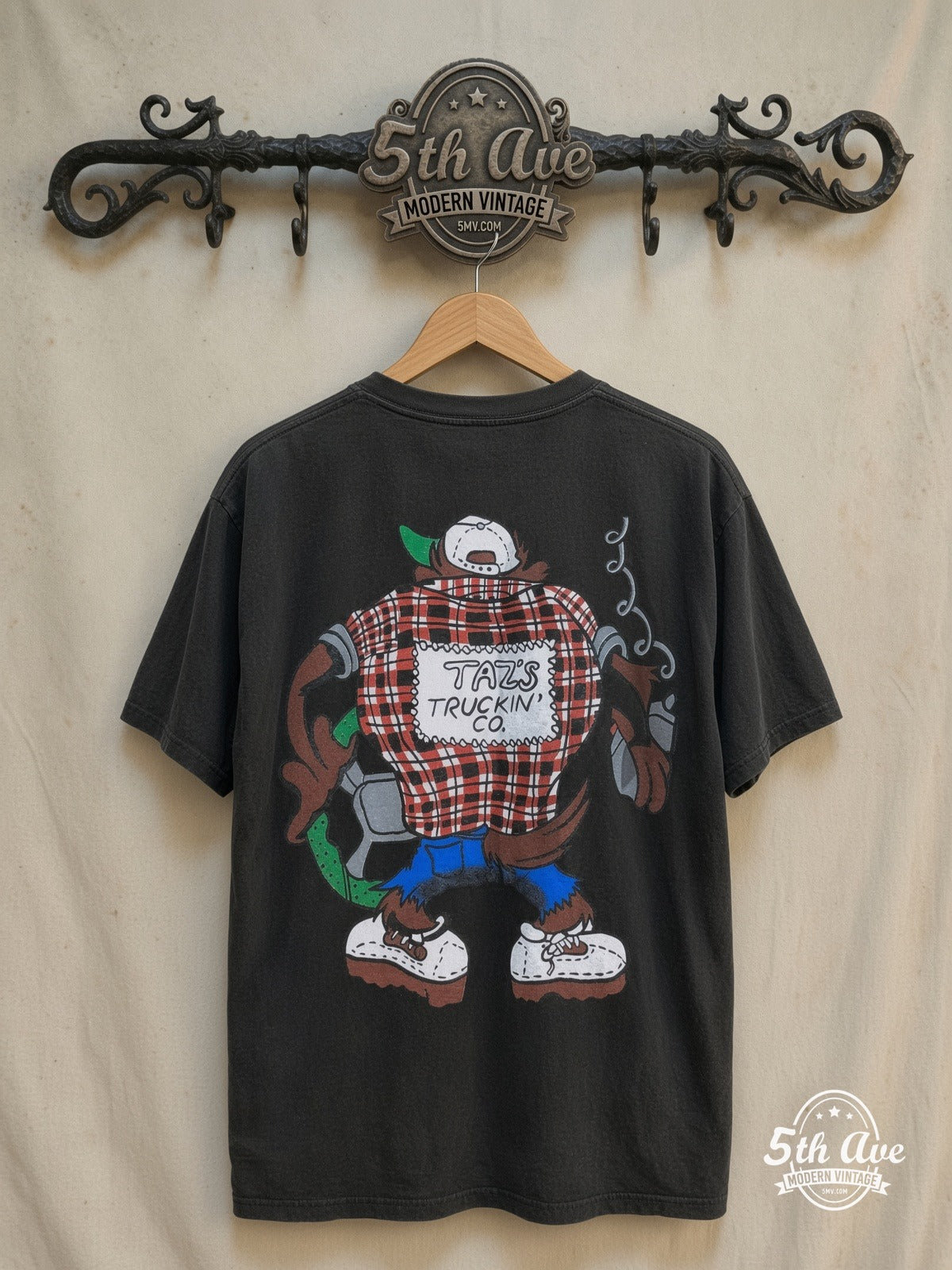 Looney Tunes – Taz's Truckin' Co. – New Vintage Graphic Tee — back on locked cream ornate 5th Ave rack