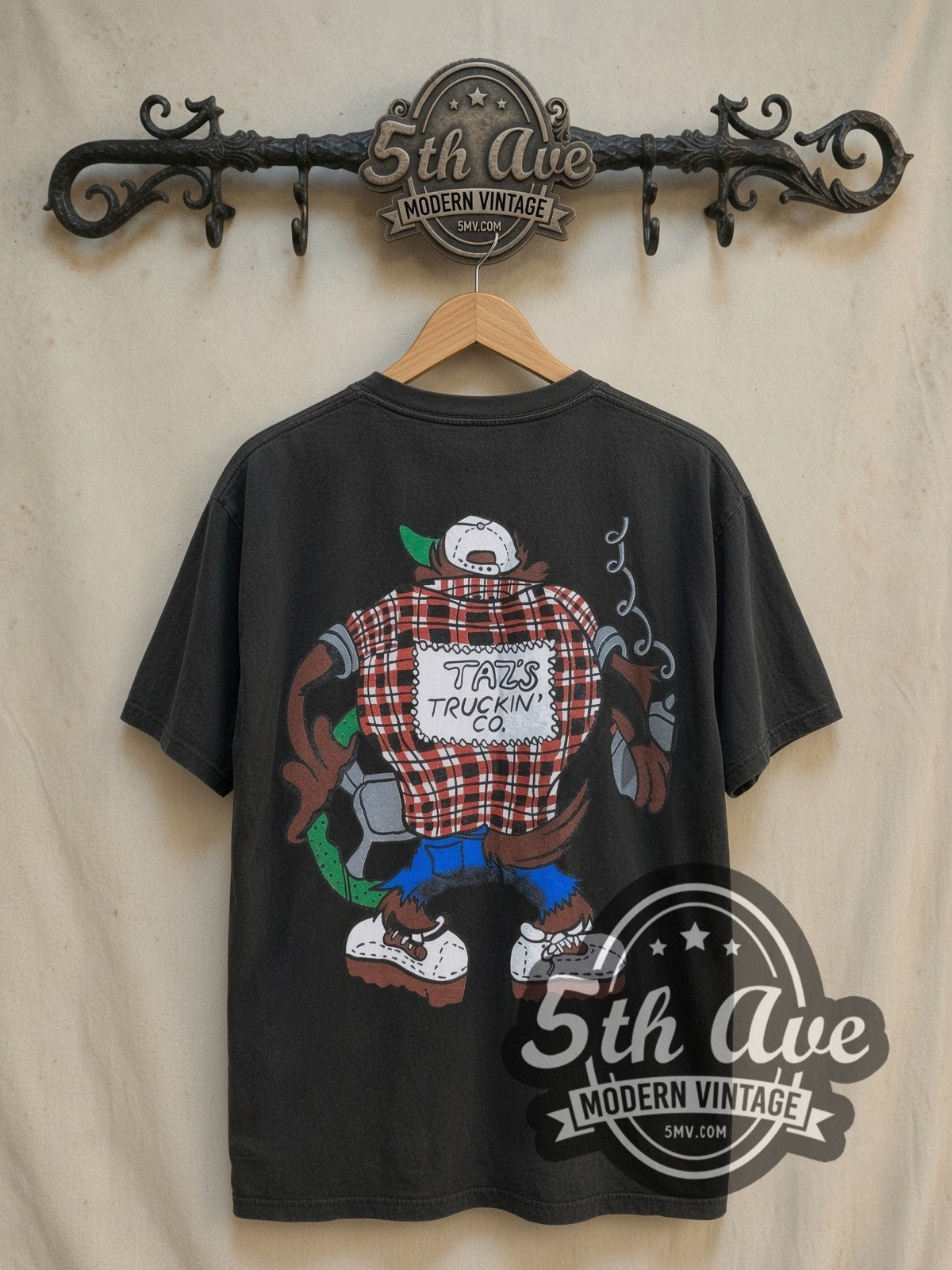 Looney Tunes Taz's Truckin' Co. vintage cartoon tee, back view on a display rack