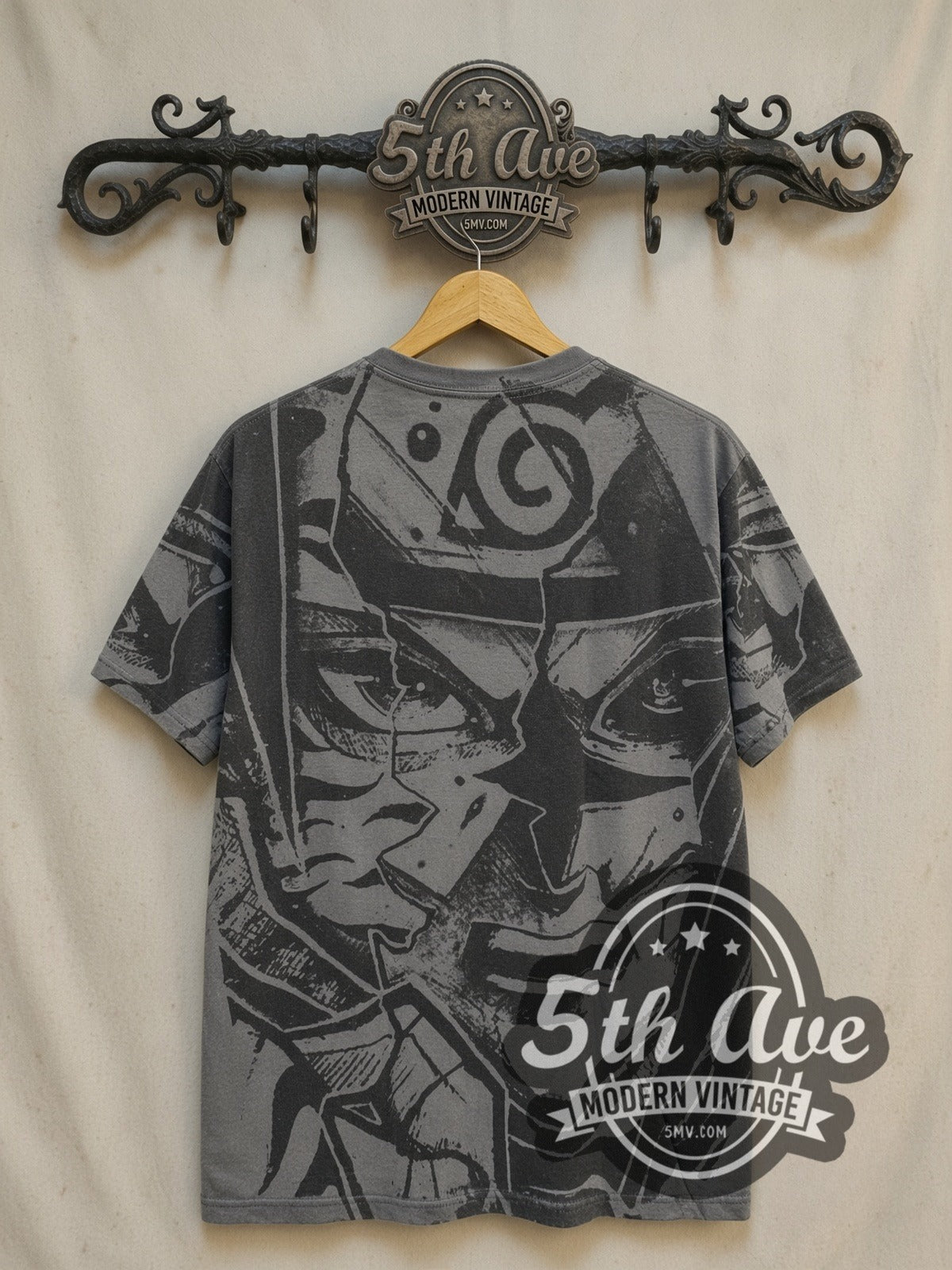 Naruto Shippuden Split Face Hidden Leaf all-over-print vintage graphic t-shirt, back view on a display rack