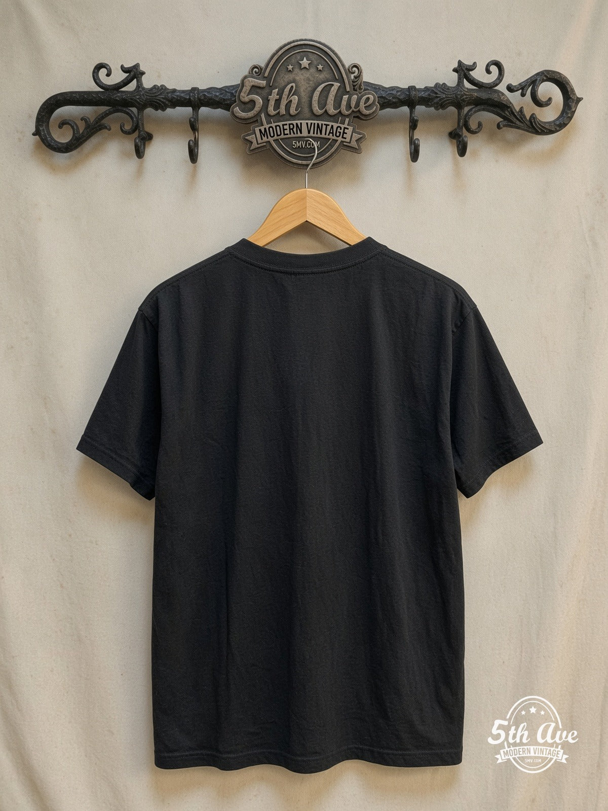 Ozzy Osbourne – Blizzard of Ozz – Vintage Band T-Shirt — back on locked cream ornate 5th Ave rack