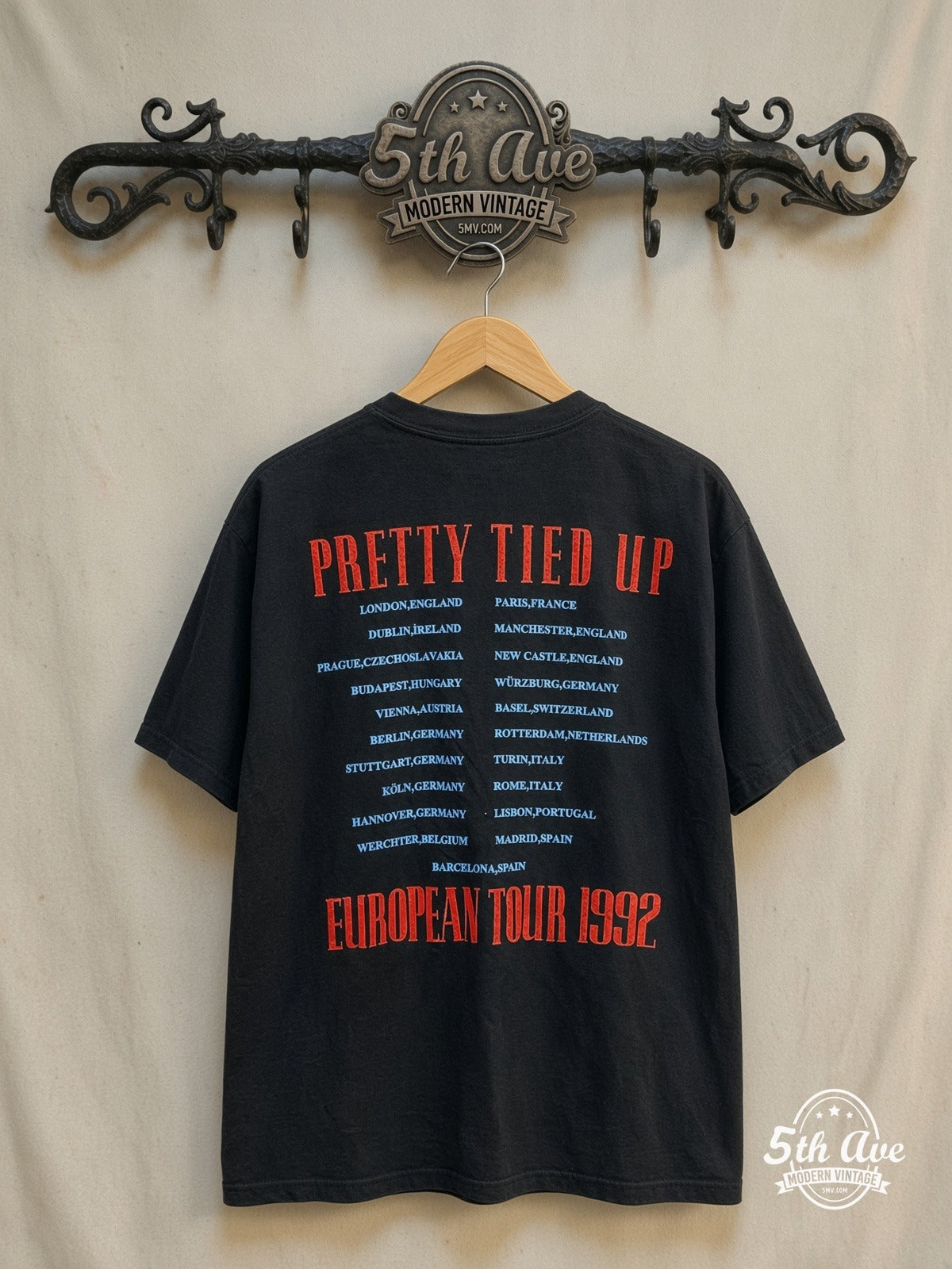 Guns N' Roses Pretty Tied Up Tour 1992 vintage band t-shirt, back view on a display rack