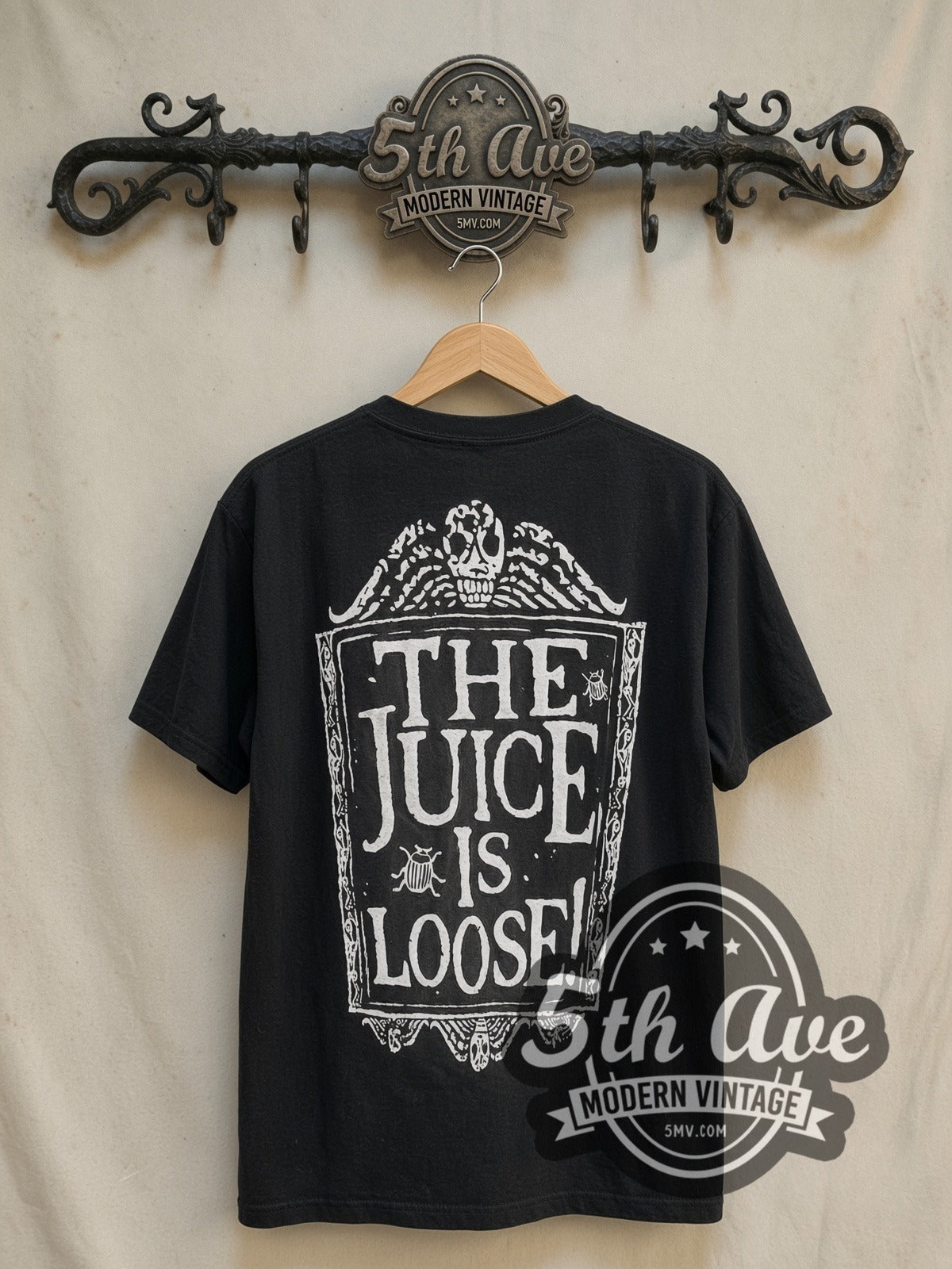 The Nightmare Before Christmas x Pulp Fiction vintage cartoon tee in black, back view on a display rack